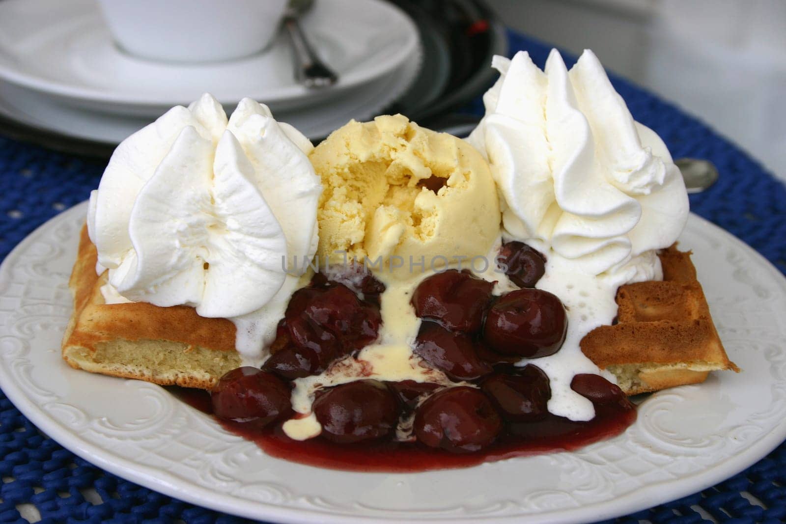 Waffle with hot cherries