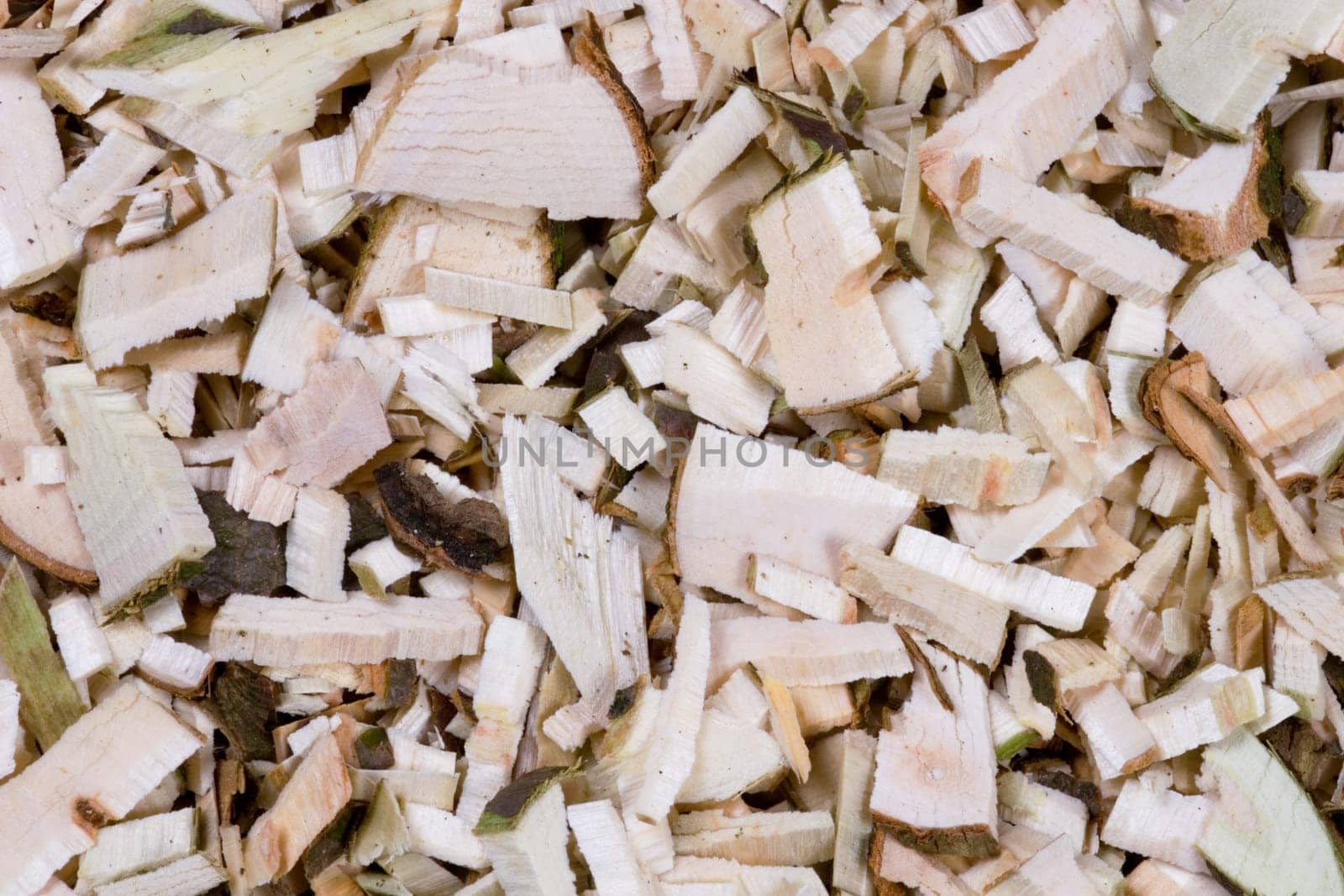 Shredded wood framed by horse mackerel as a background