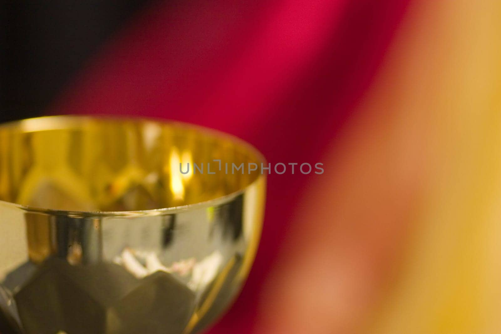 Trophy in front of national colours