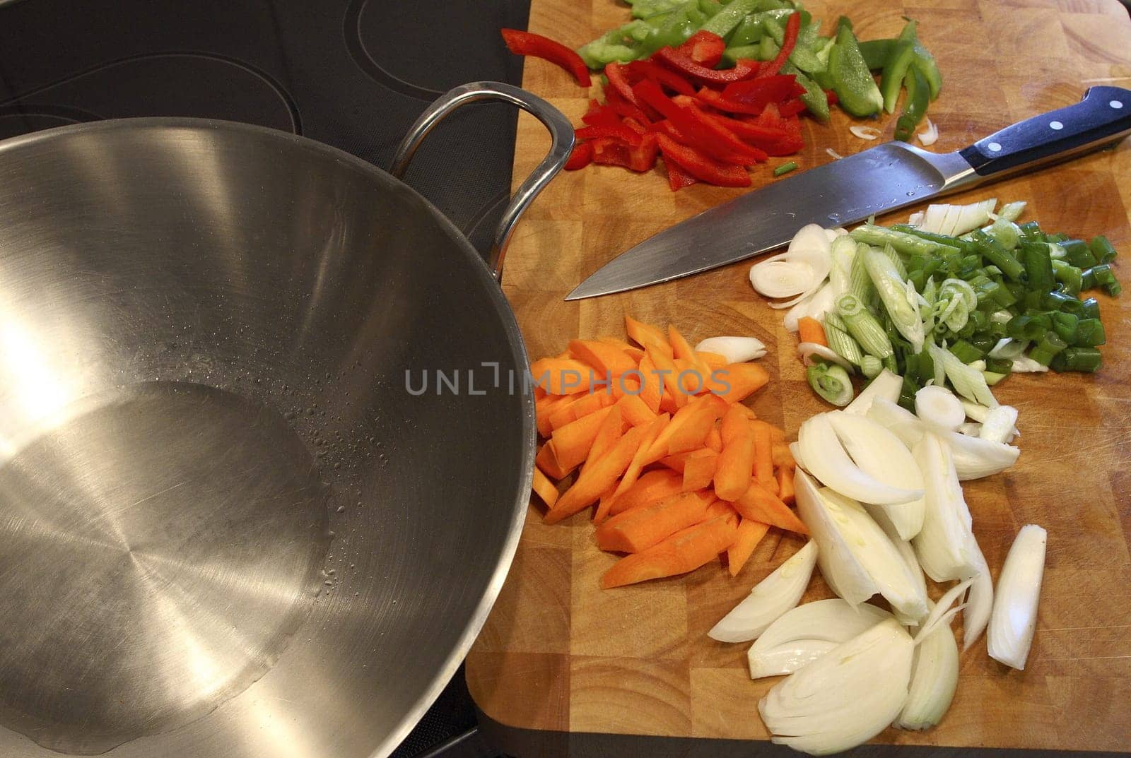 Preparation is the be-all and end-all here. When everything is cut,the vegetables are cooked crisp by stir-frying them briefly in a wok.