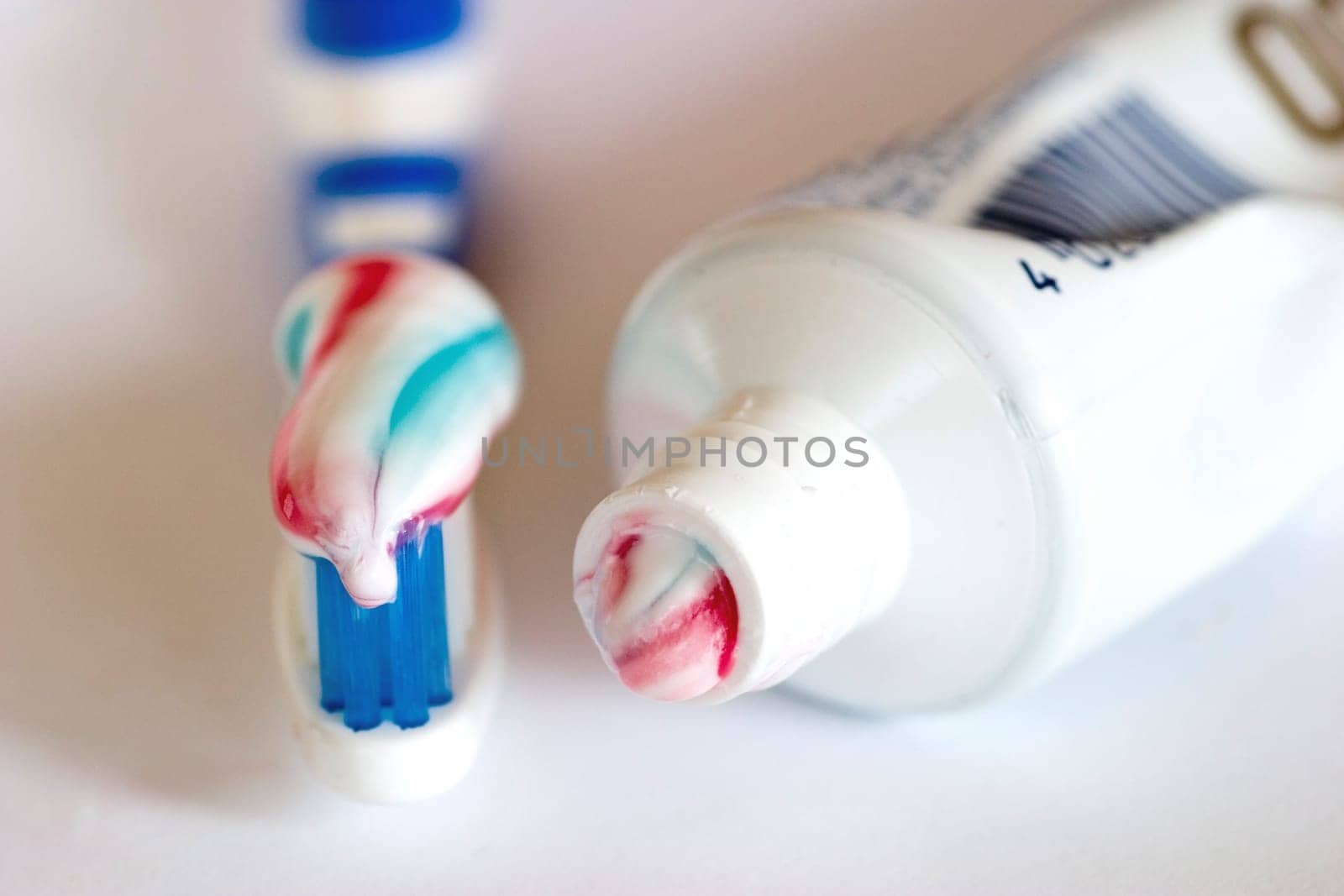 Toothbrush with toothpaste and tube