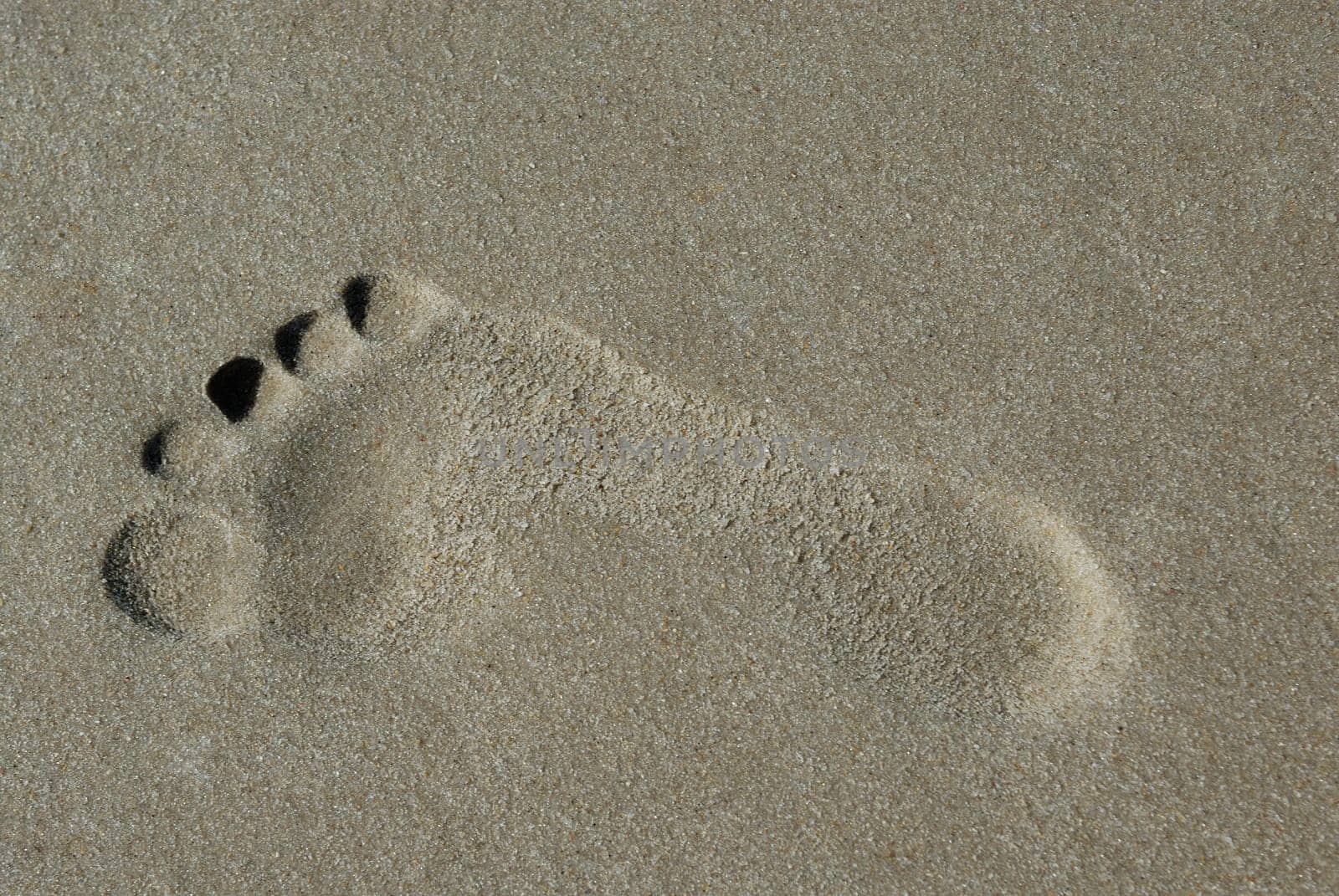 Footprint of a foot on sand