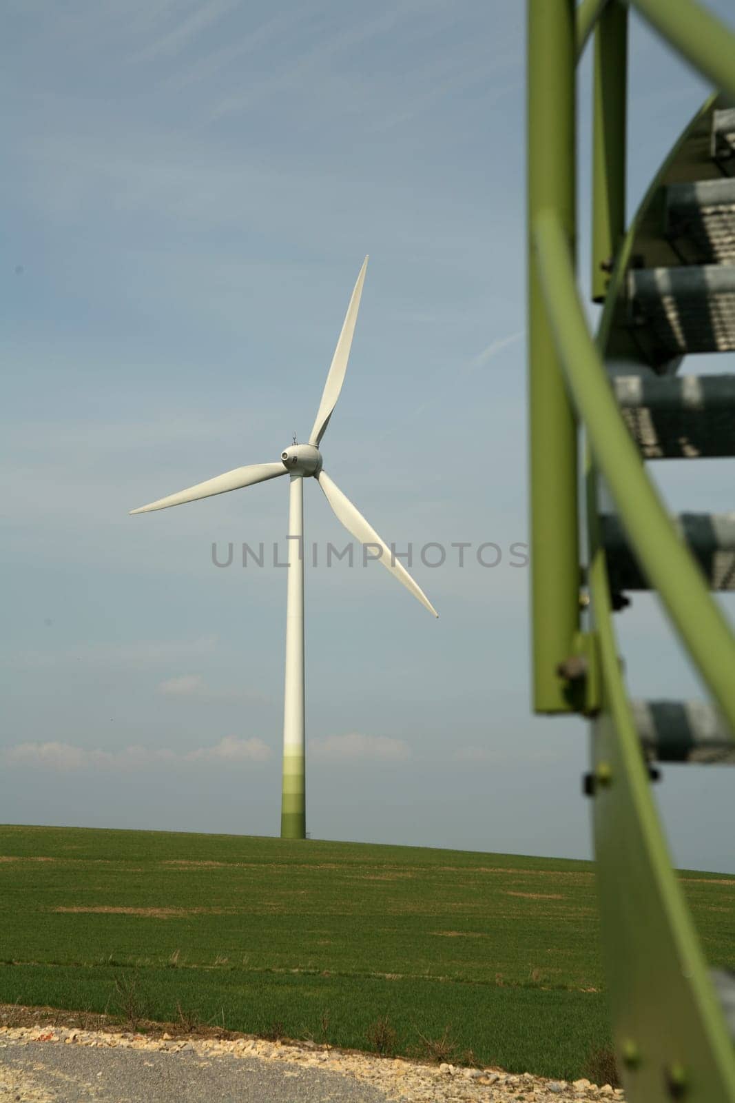 Wind turbine,in the foreground the part of a staircase of another wind turbine