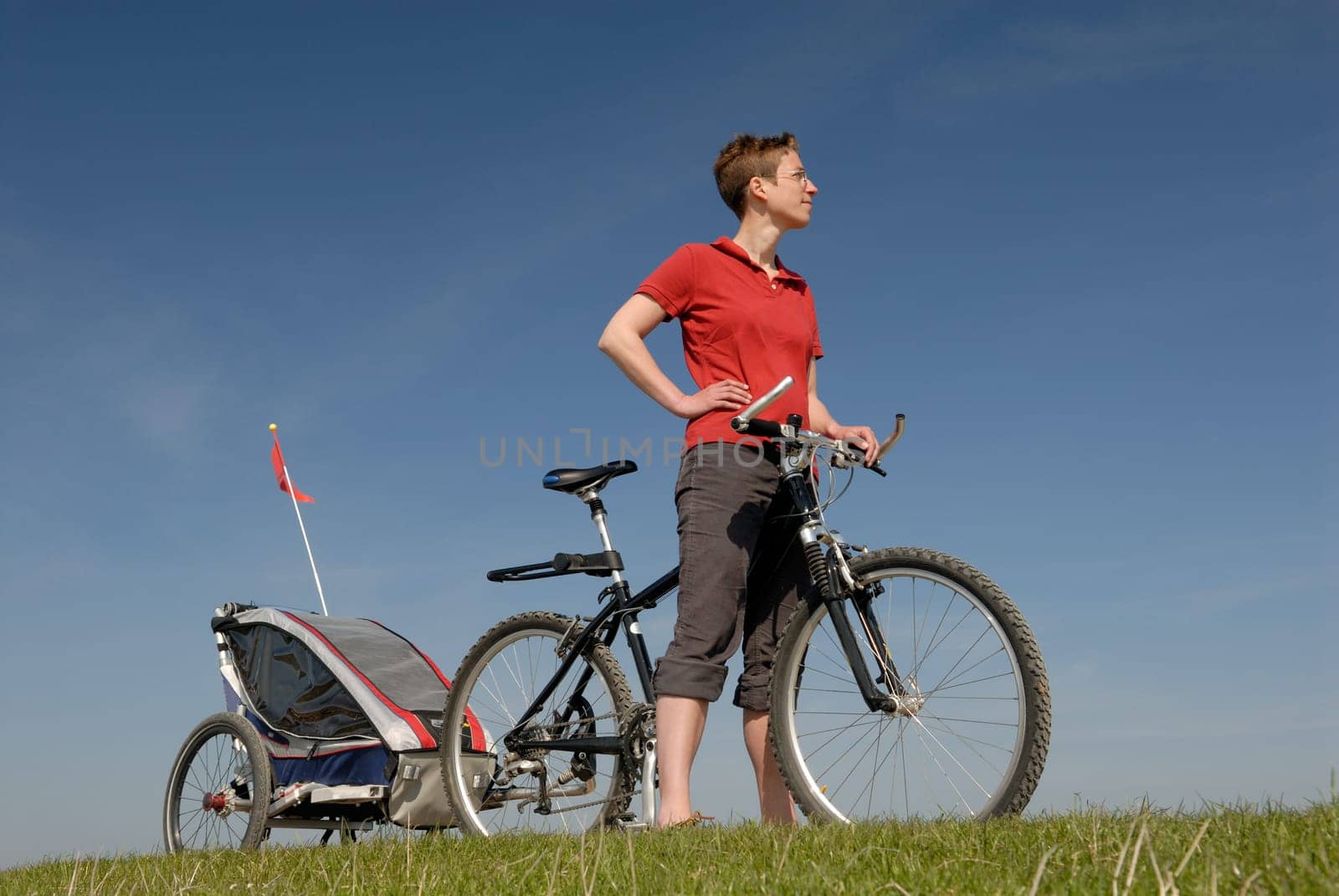 Woman with bicycle and trailer on the island of Sylt,Germany