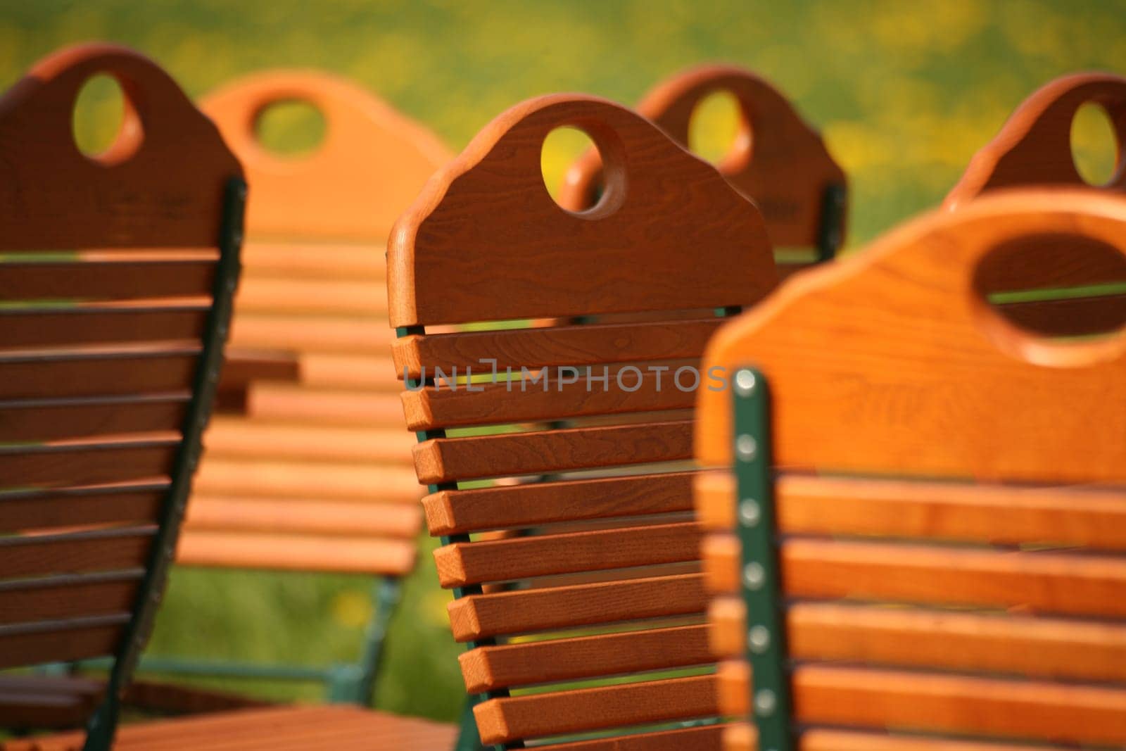 Wooden folding chairs in a garden restaurant