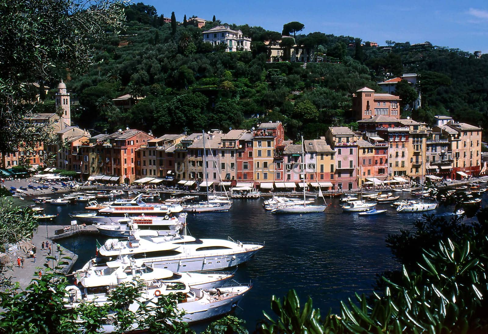 --Scan of Dia--Portofino is a beautiful place on the Ligurian coast between Genoa and La Spezia. Fine restaurants and bars along the street promenade give the place a certain Mediterranean character. Especially beautiful is the spring/summer