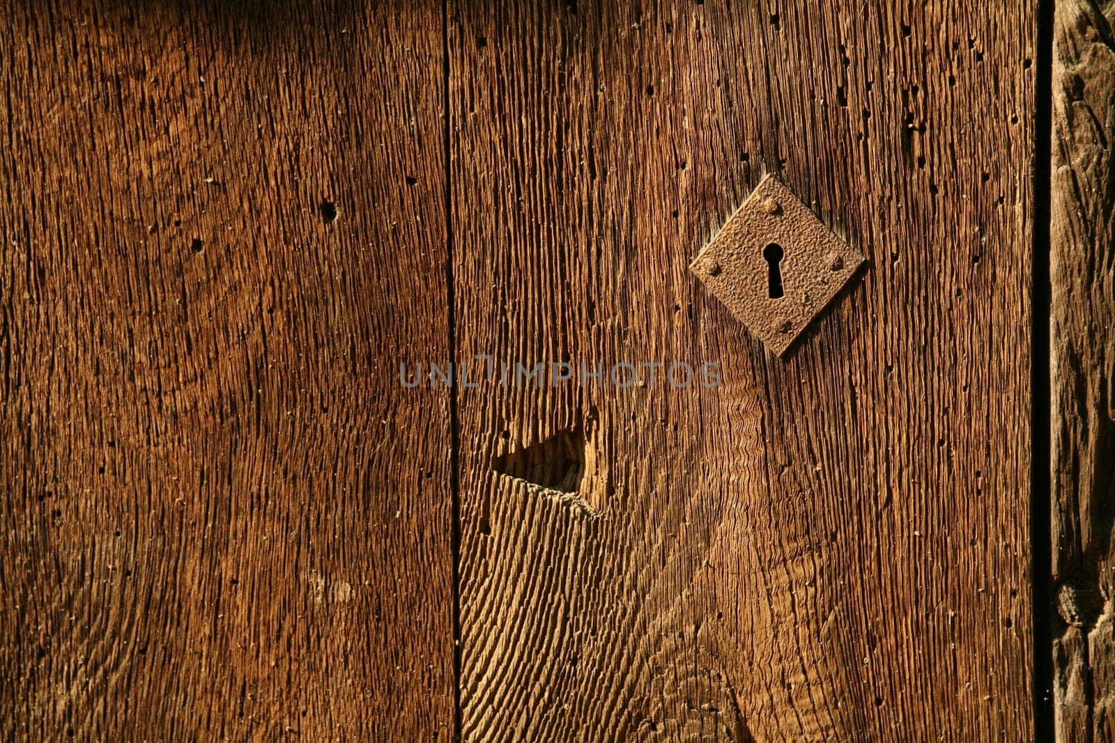 Keyhole in an ancient wooden door