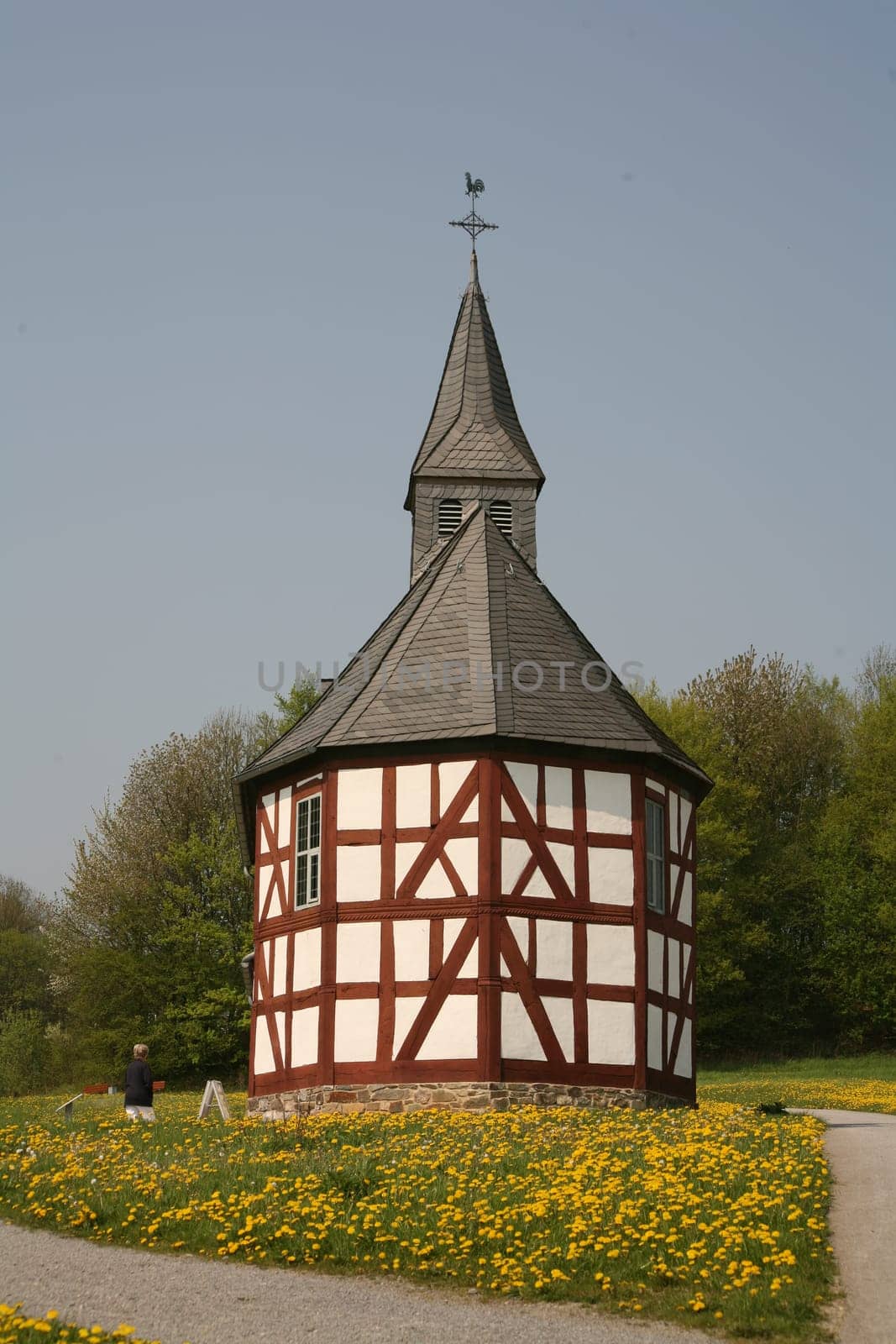 Small chapel with dandelion meadow
