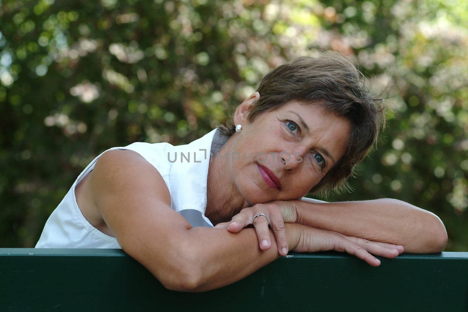 Middle-aged woman on a park bench