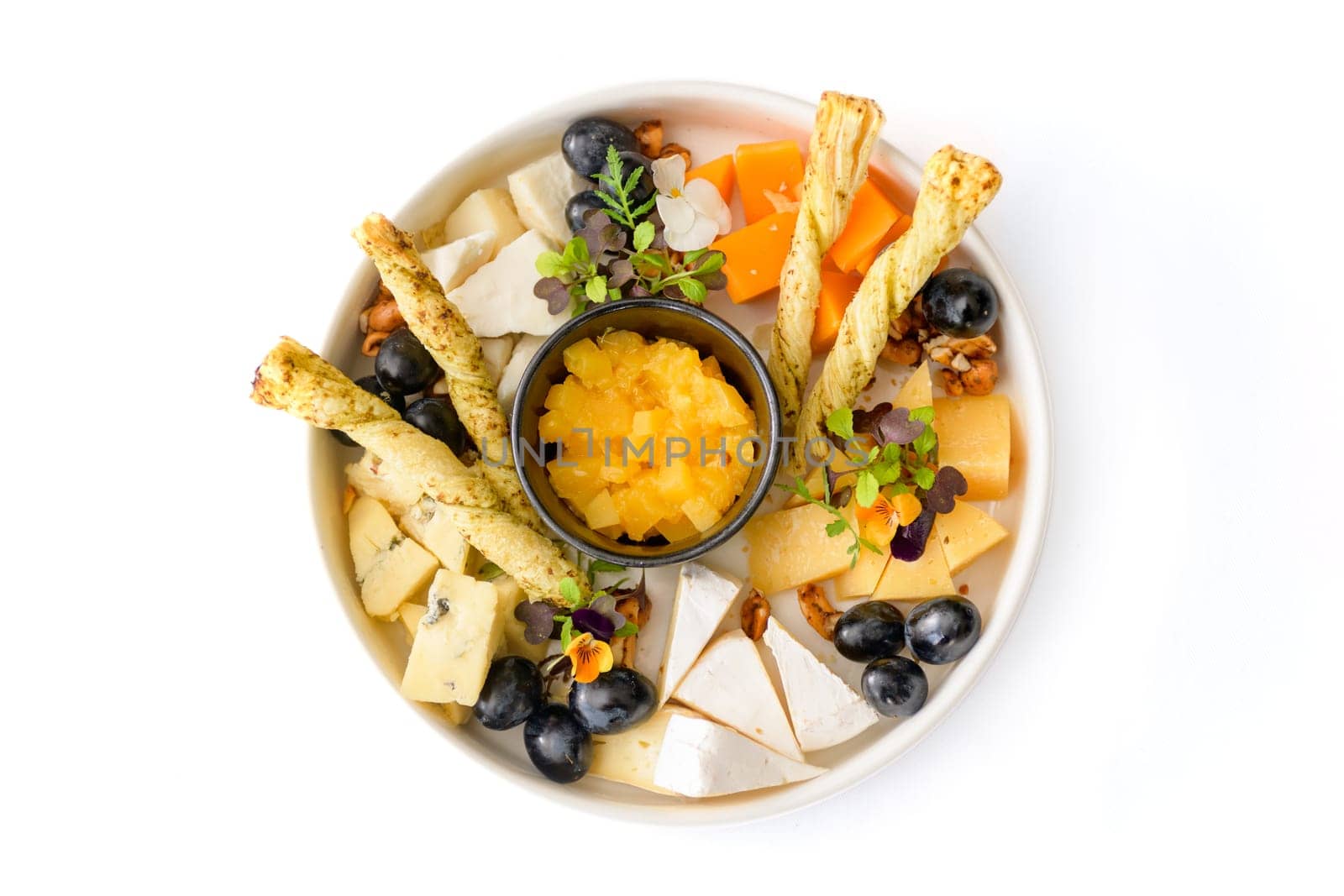 Plate of Mediterranean antipasto snacks. Flat lay, isolated, overhead. High quality photo