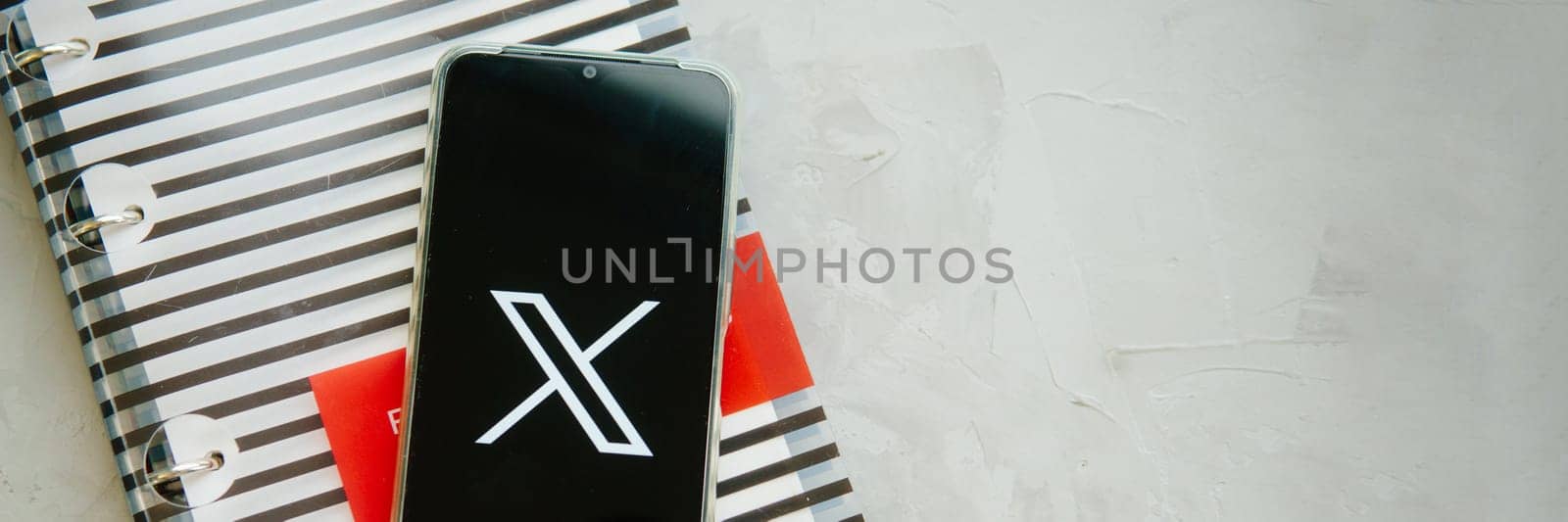 July 25, 2023, Russia. The logo in the form of the letter X displayed on the smartphone. Twitter rebranding, and implementation of X