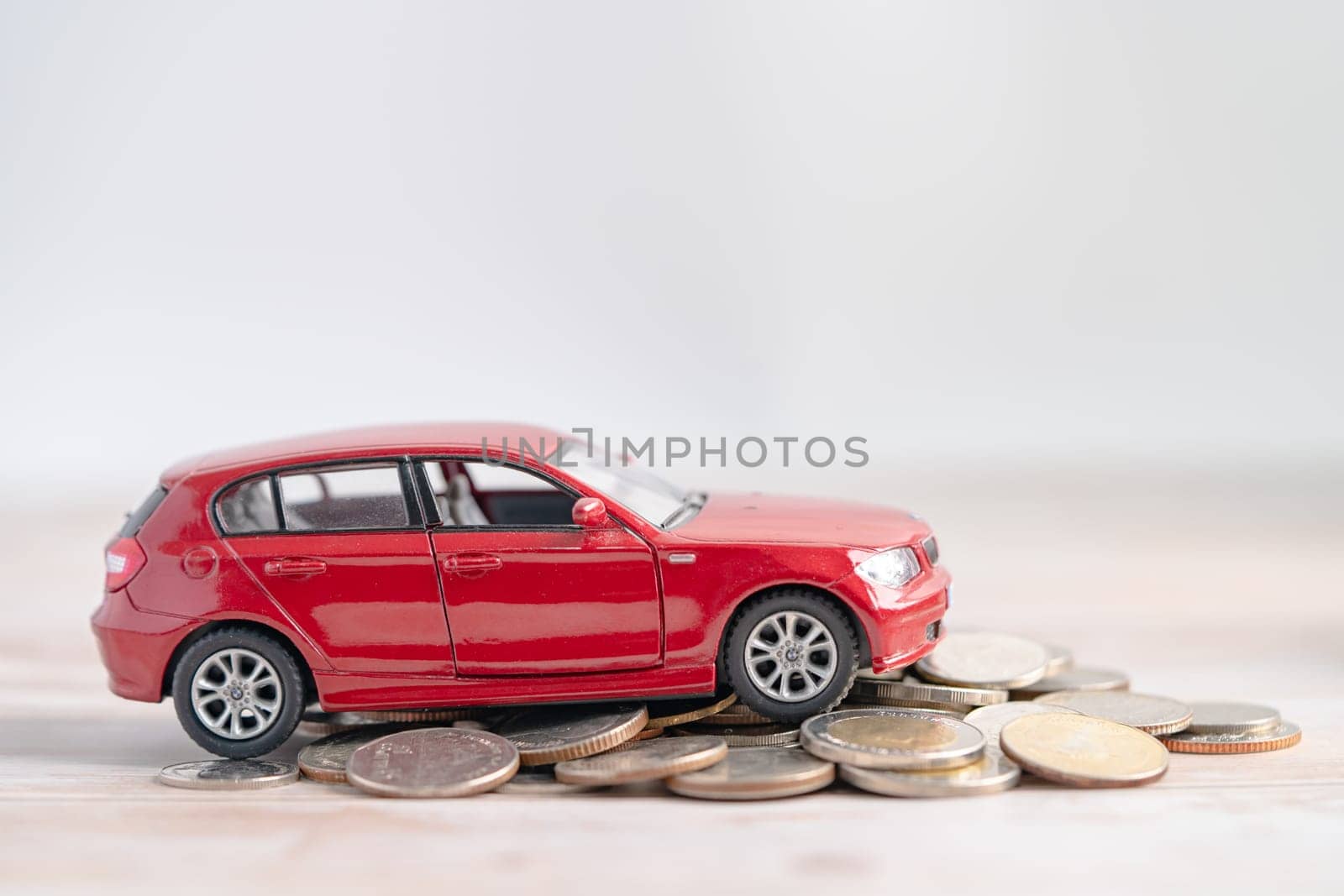 Bangkok, Thailand, January 1, 2023 Car and coins, Car loan, Finance, saving money, insurance and leasing time concepts. by pamai