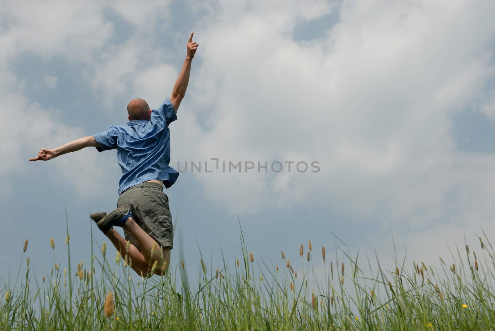 Young man jumping in the air