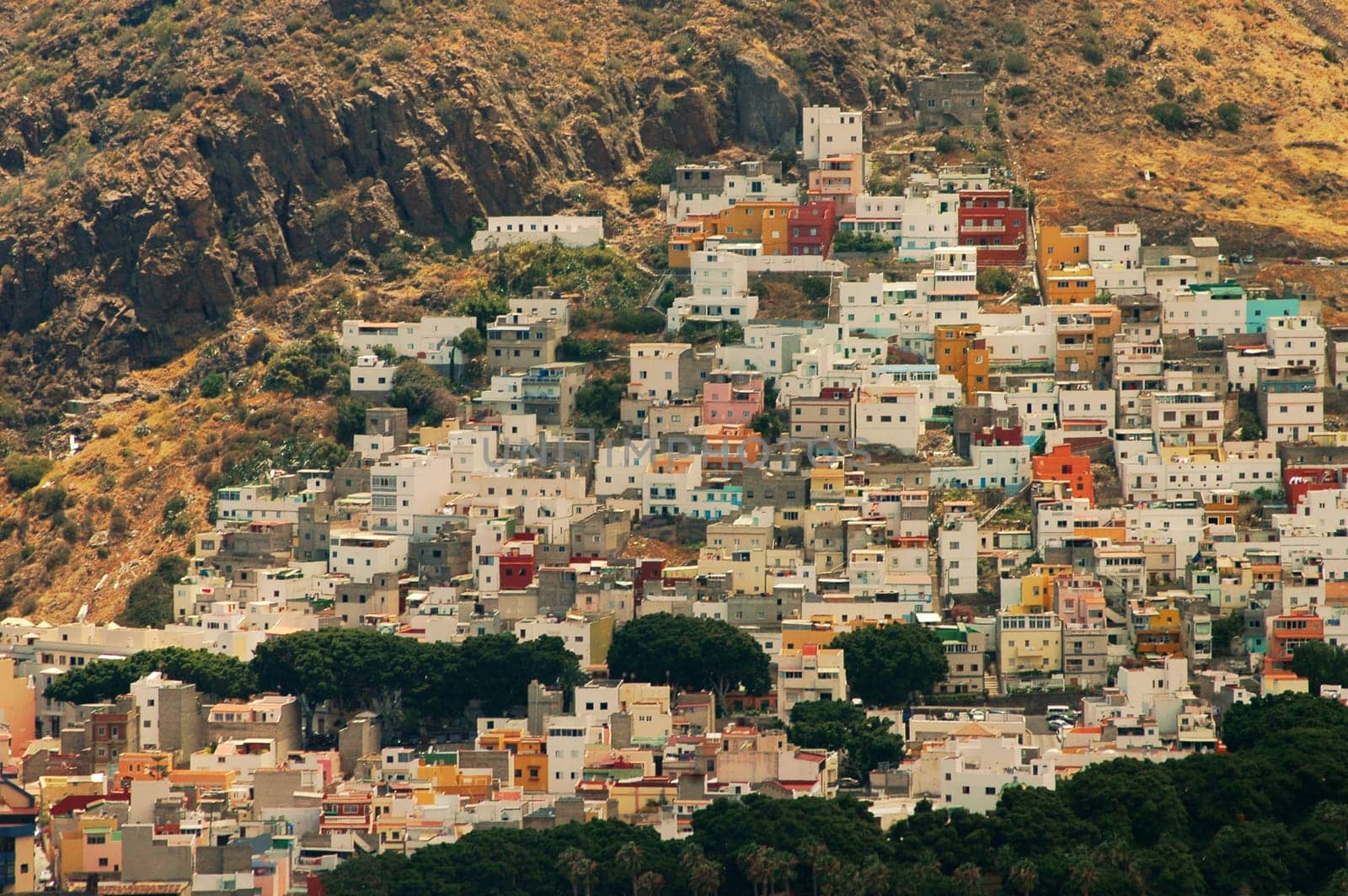 In the north of Tenerife you will find some housing estates that are not as massive as in the south! I am disappointed by the south,because one hotel is being built next to the other.....!