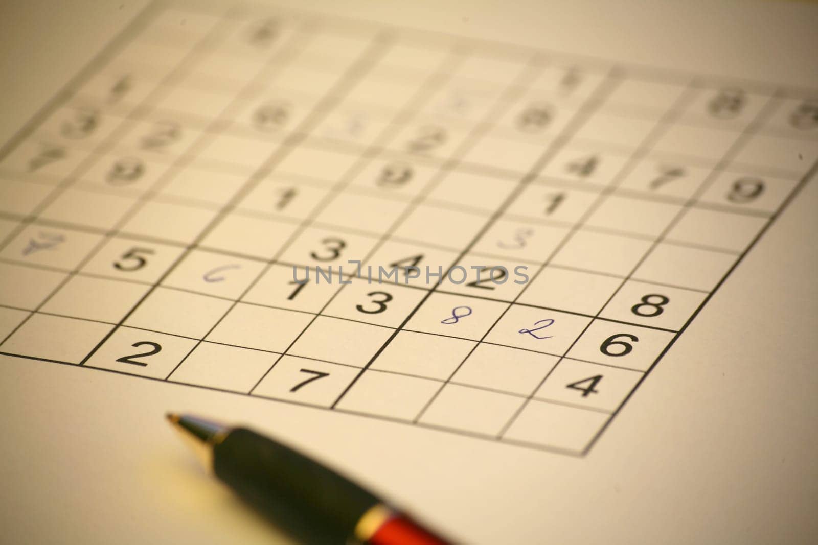 Sudoku with black and red ballpoint pen