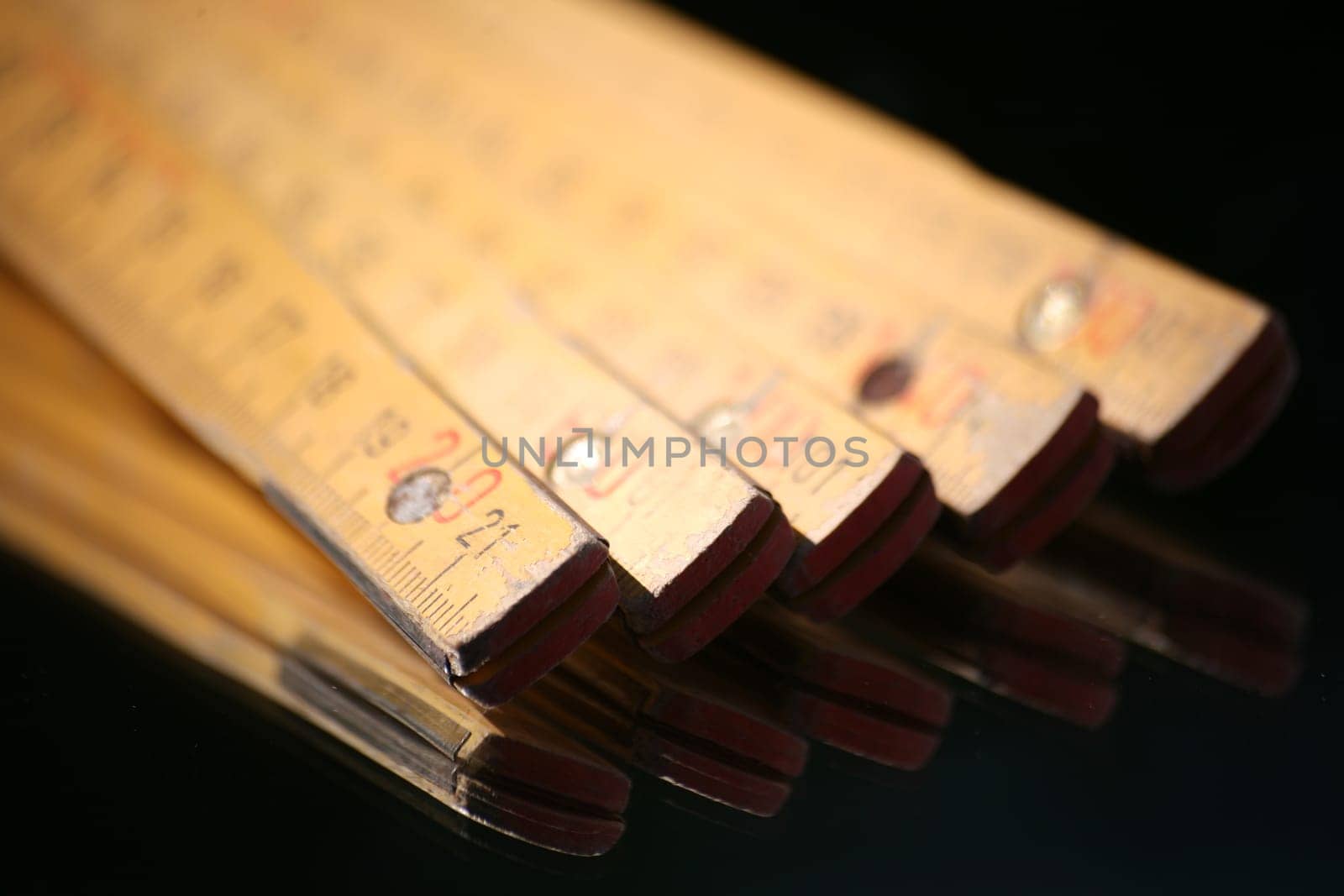 Yellow wooden measuring rod made in Germany