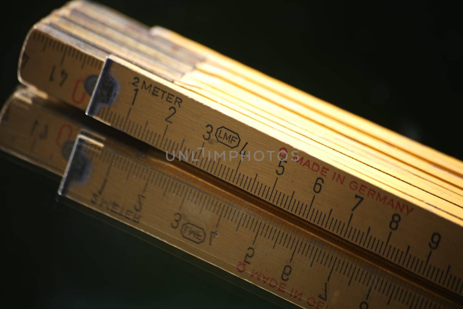 Yellow wooden measuring rod made in Germany