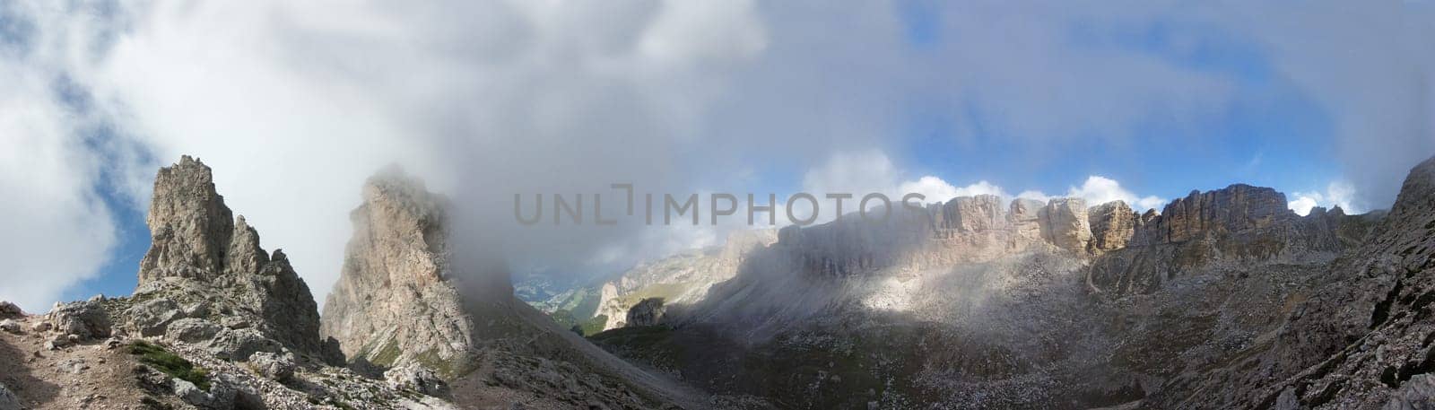 240° panoramic view at the Cirjoch.Im valley you can still see very tiny Selva Gardena. Partly in clouds the cir peaks.