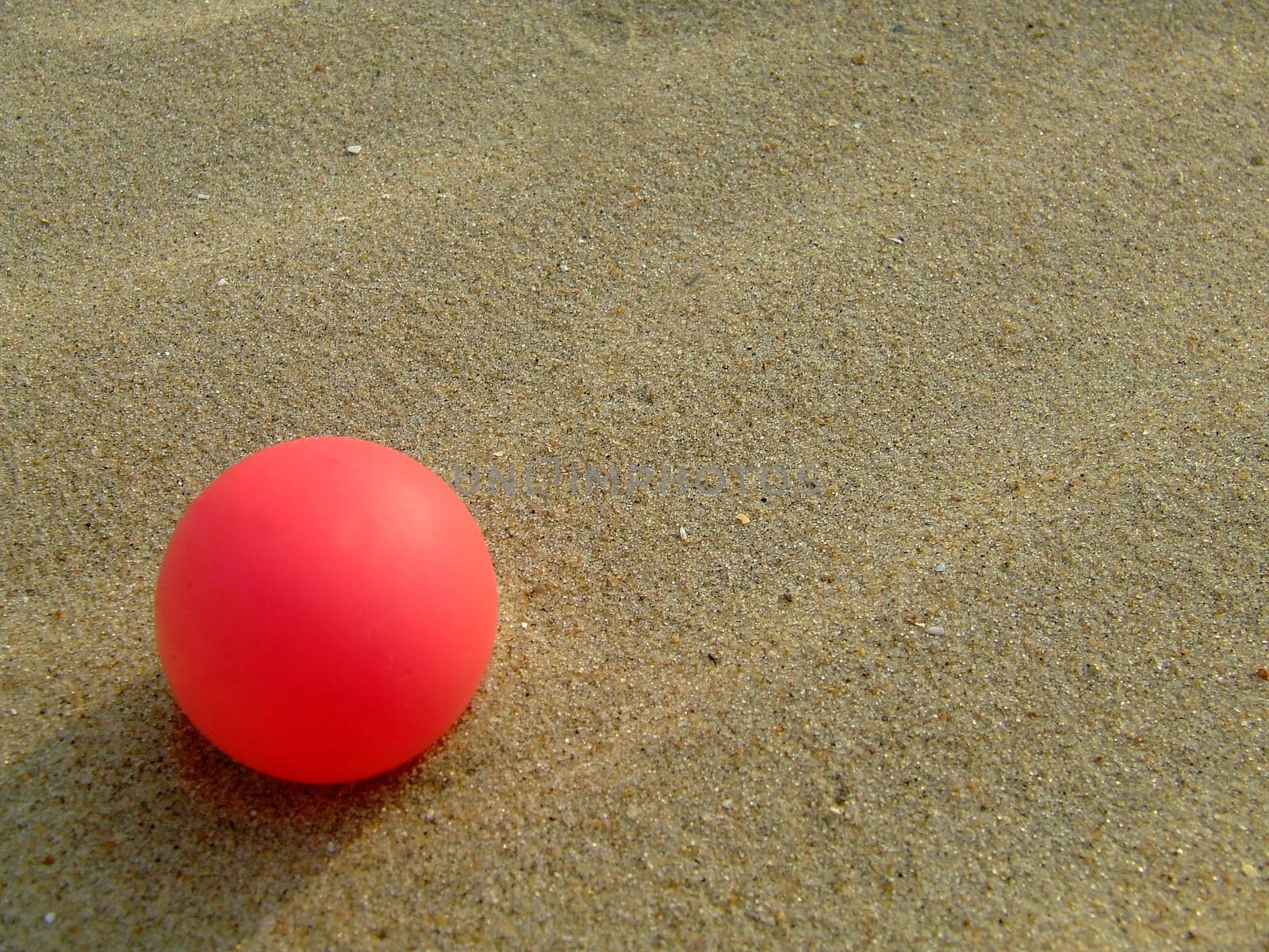 Red ball on the beach