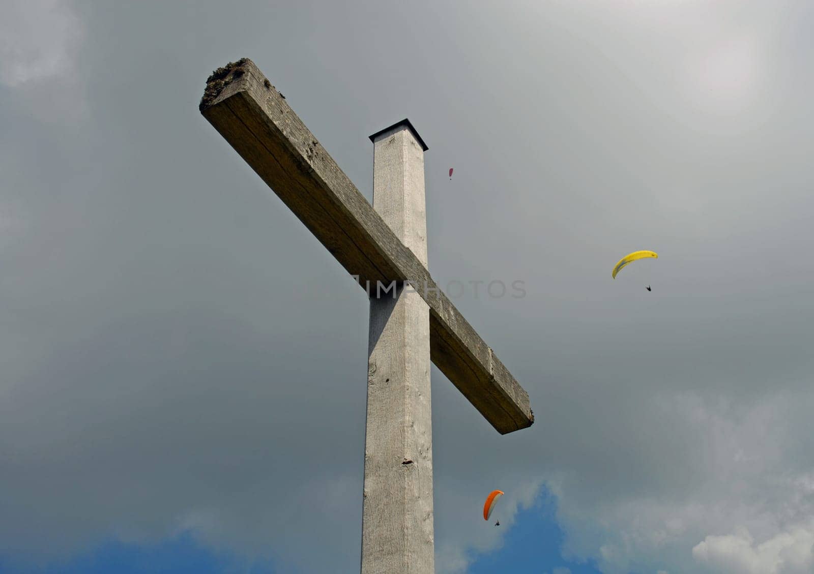 Often the cross and the sport of hang gliding are only one step away from each other