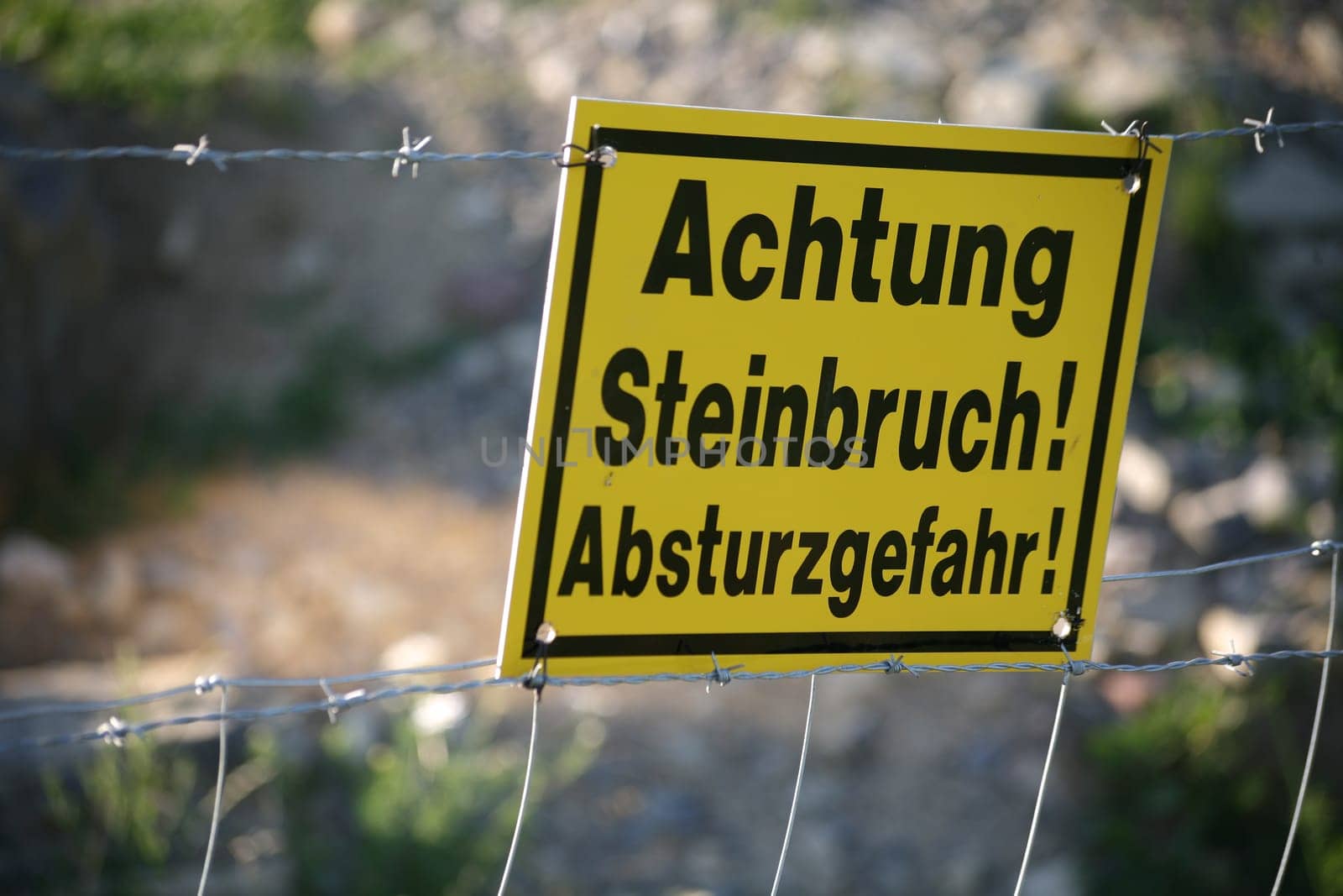 Sign on the edge of a quarry