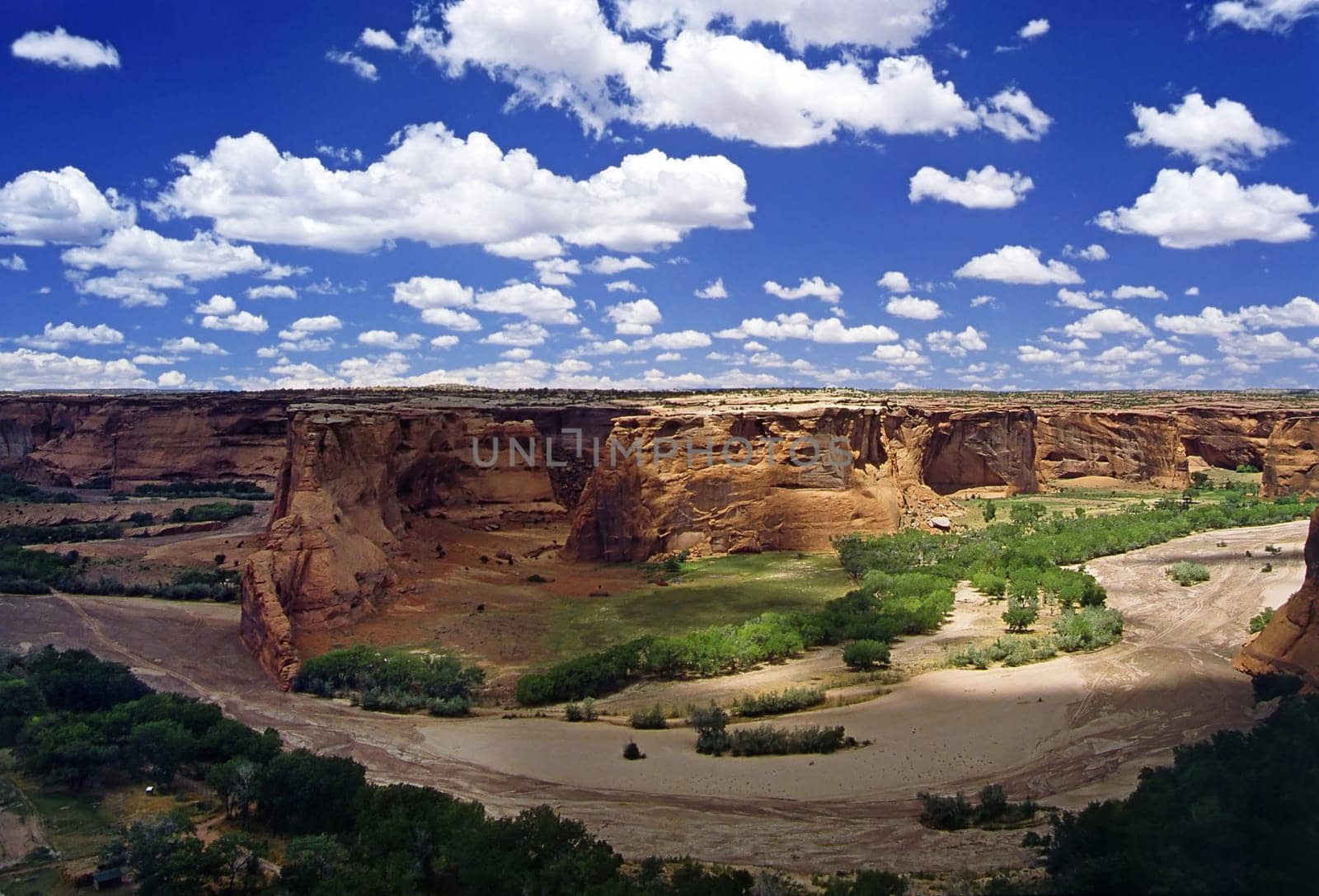 Canyon de Chelly National Monument is located in northeastern Arizona and is part of the Navajo Nation Reservation. Two roads run over the canyons along the rims,North Rim Drive at Canyon del Muerto and South Rim Drive at Cany