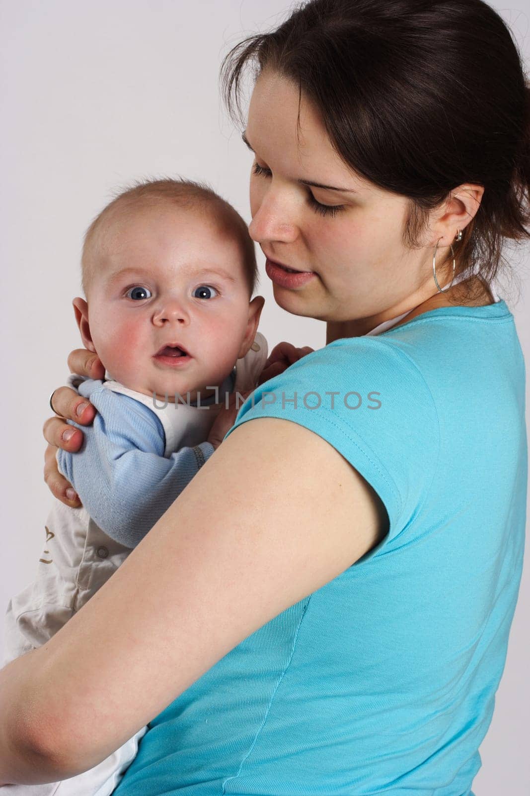 Mom holds her child in her arms