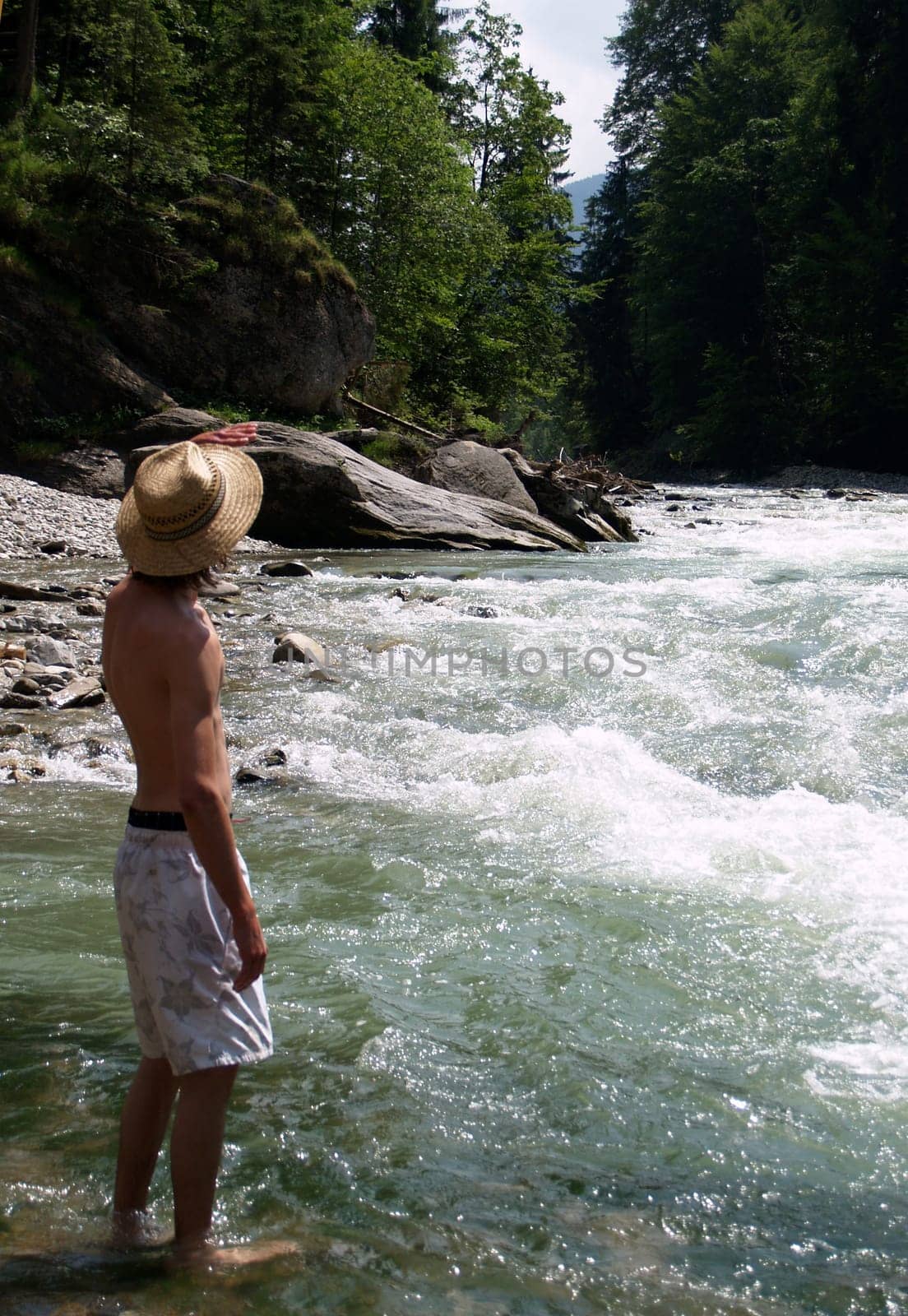 by the rushing stream
