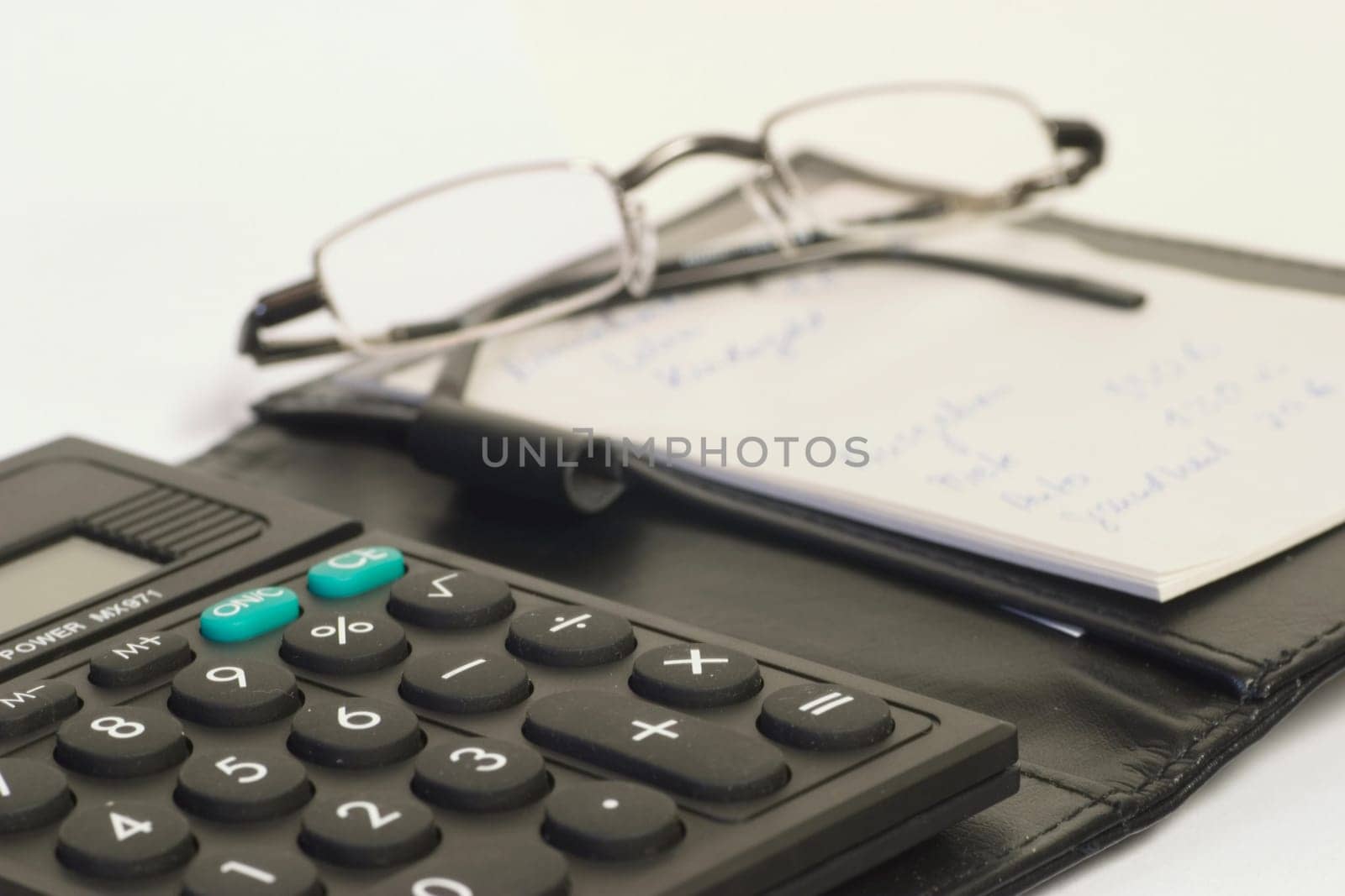 Folder with calculator and notebook