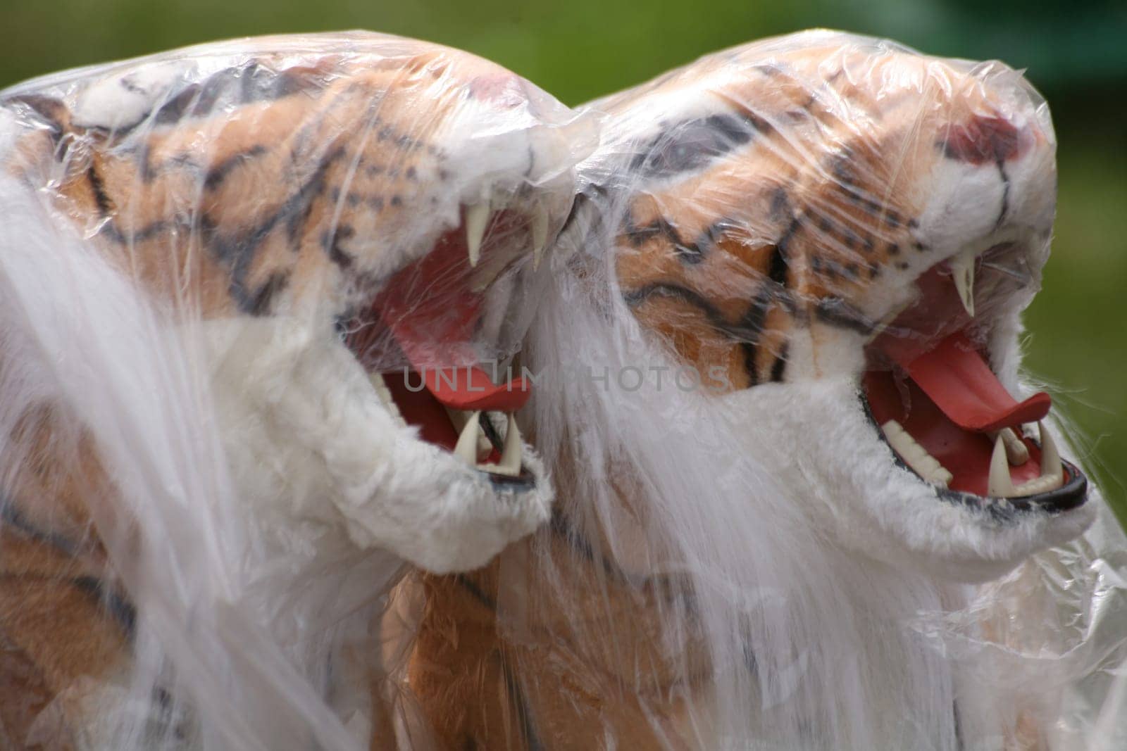 Foil-wrapped plush tigers at a flea market