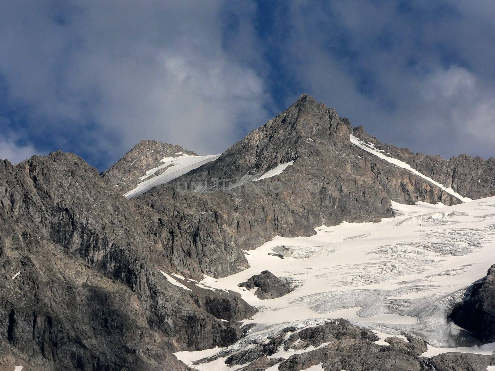 La Meije,the "Giant Sphinx"" of the Alps,is a 3,983 m high mountain in the Pelvoux in the Dauphiné Alps,which are part of the French Western Alps. Surrounded by large glaciers in the north and east,the mountain shows from the south with its 800 m above sea level"