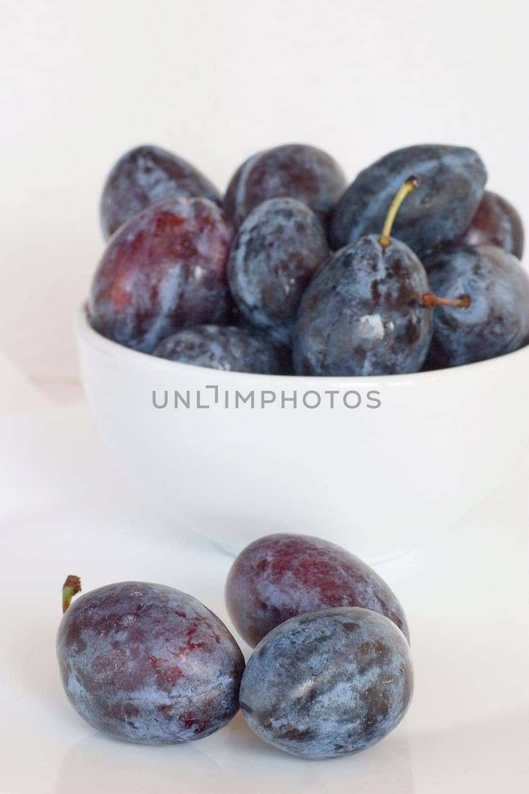 Plums on a white background