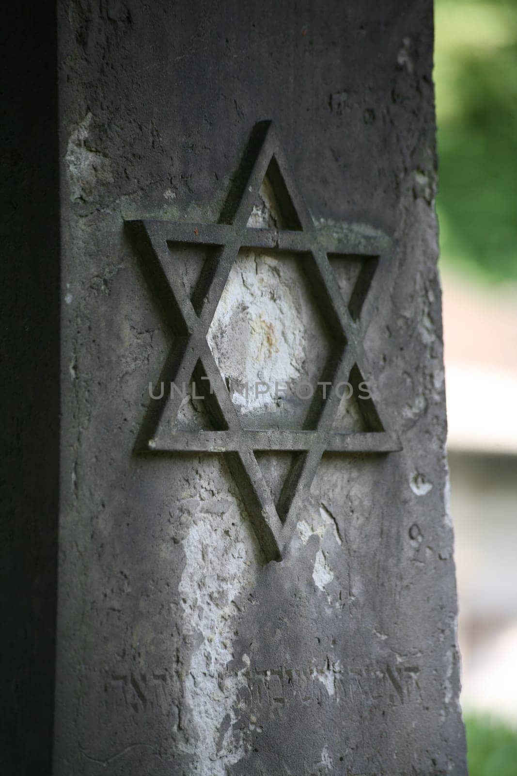 Star of David on the tombstone of an old Jewish cemetery