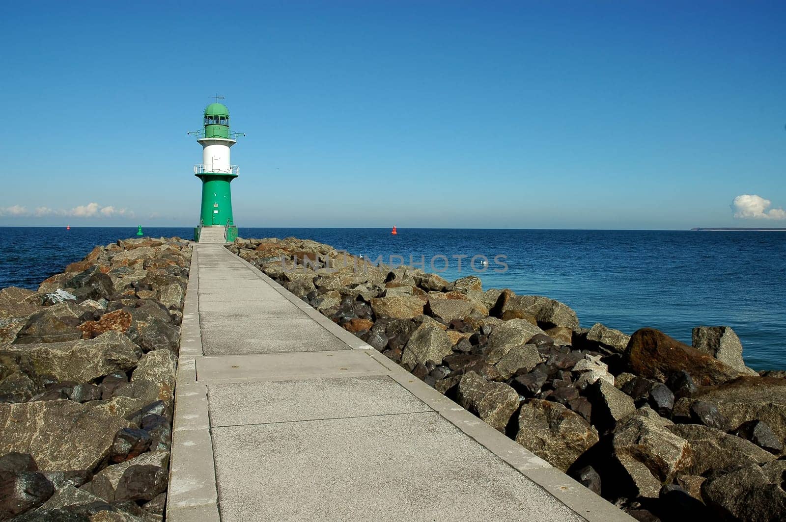 That's how I like it best - the lighthouse of Warnemünde. When it is so beautifully empty,I also have time to watch the sea,see the ships arrive and just enjoy peace and loneliness! If I'm honest,I'm looking forward to