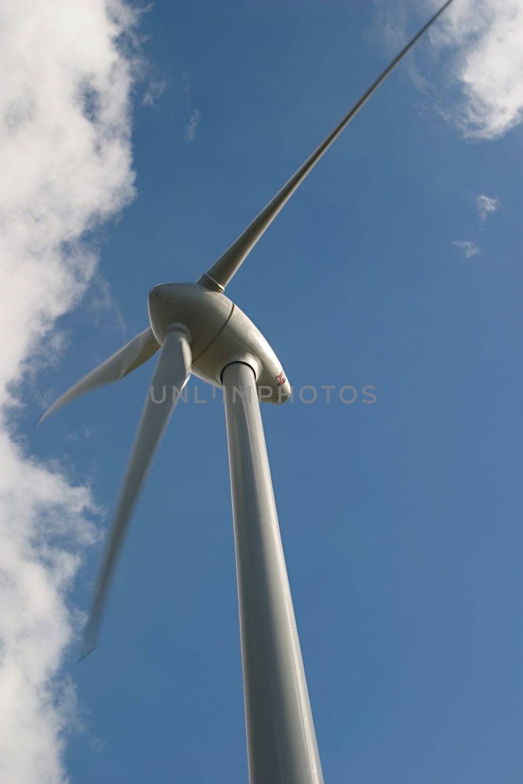 Wind turbine in front of a cloudy sky