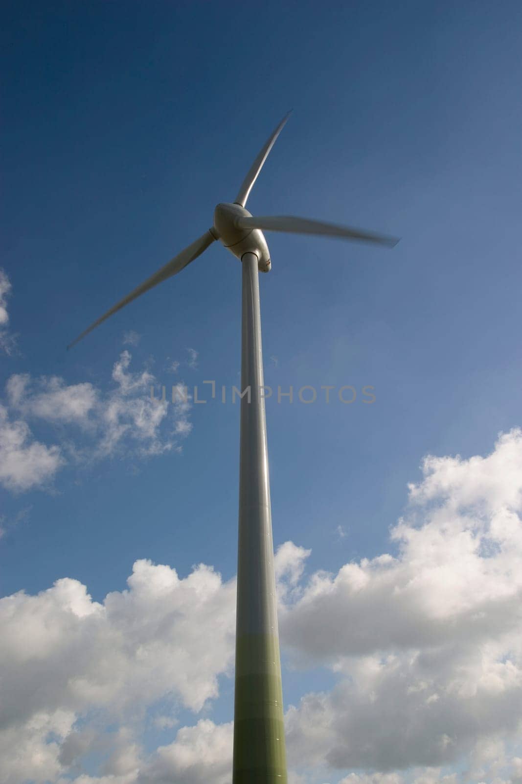 Wind turbine in front of a cloudy sky