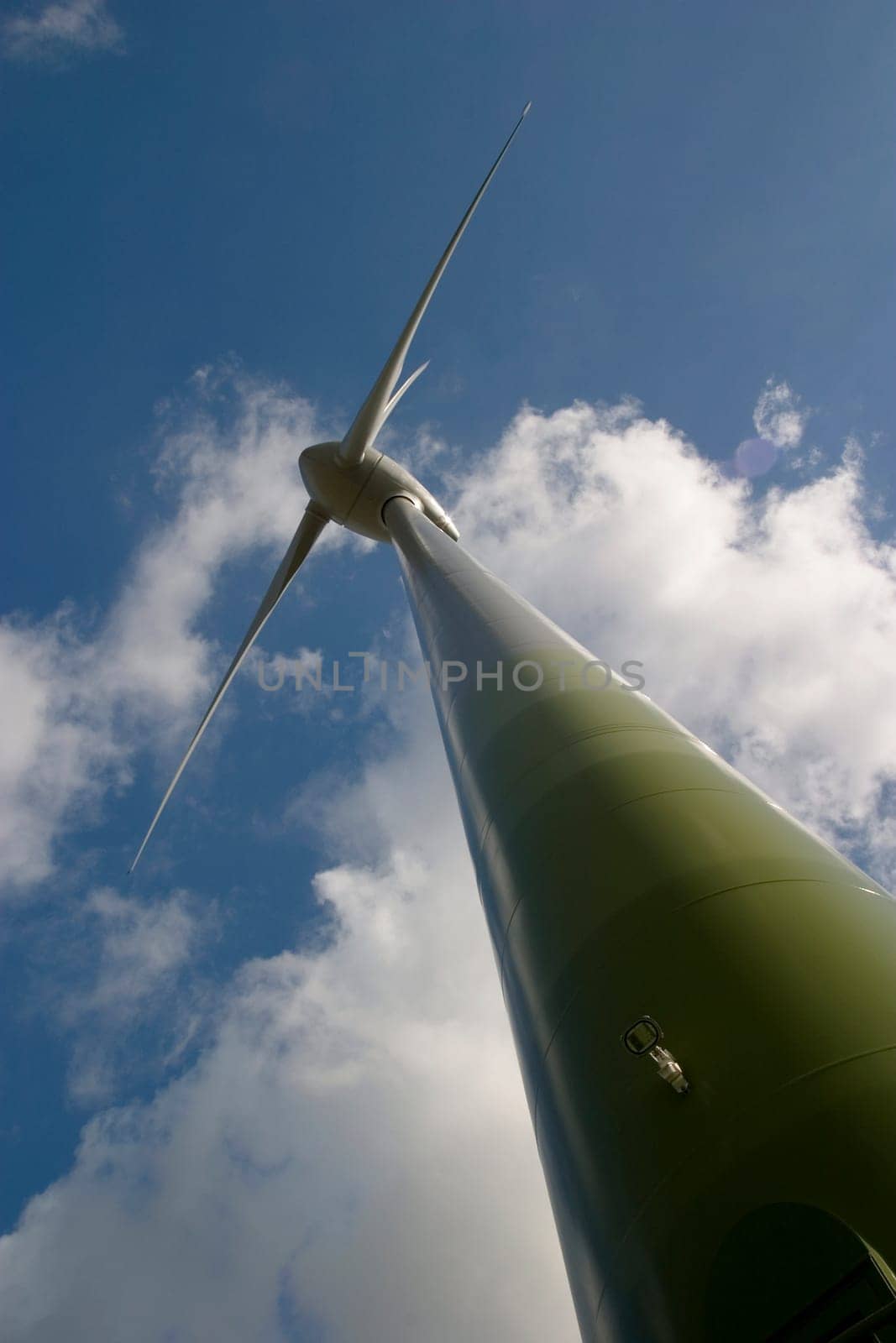 Wind turbine in front of a cloudy sky