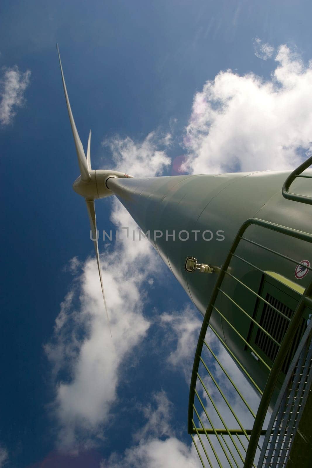 Wind turbine in front of a cloudy sky