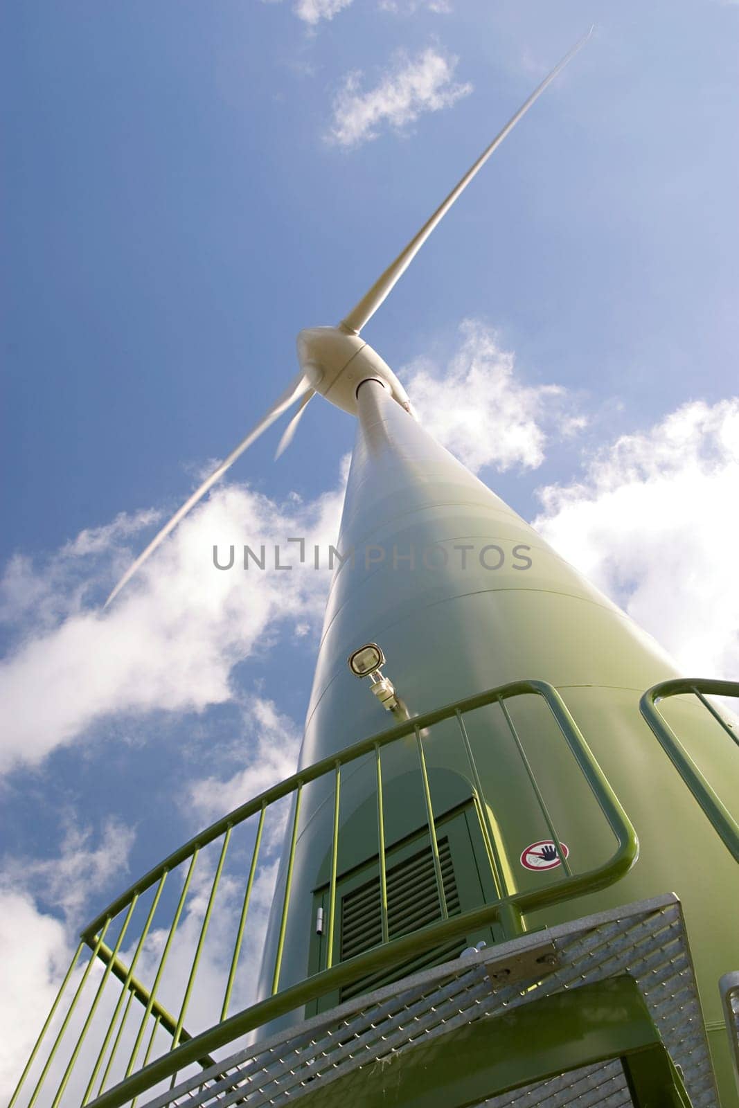 Wind turbine in front of a cloudy sky