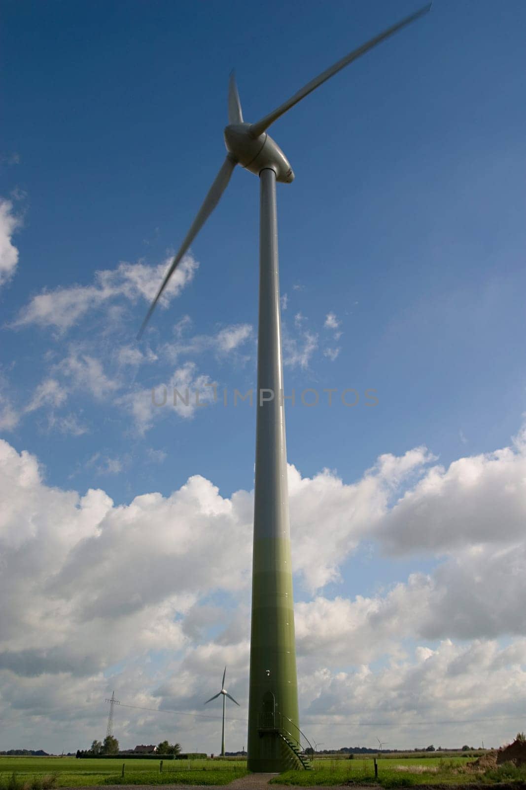 Wind turbine in front of a cloudy sky