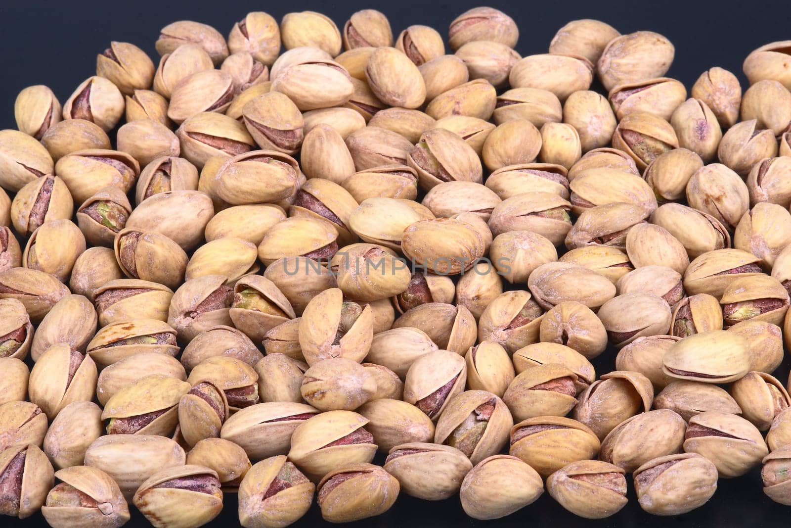 Salted pistachios in shell and loose