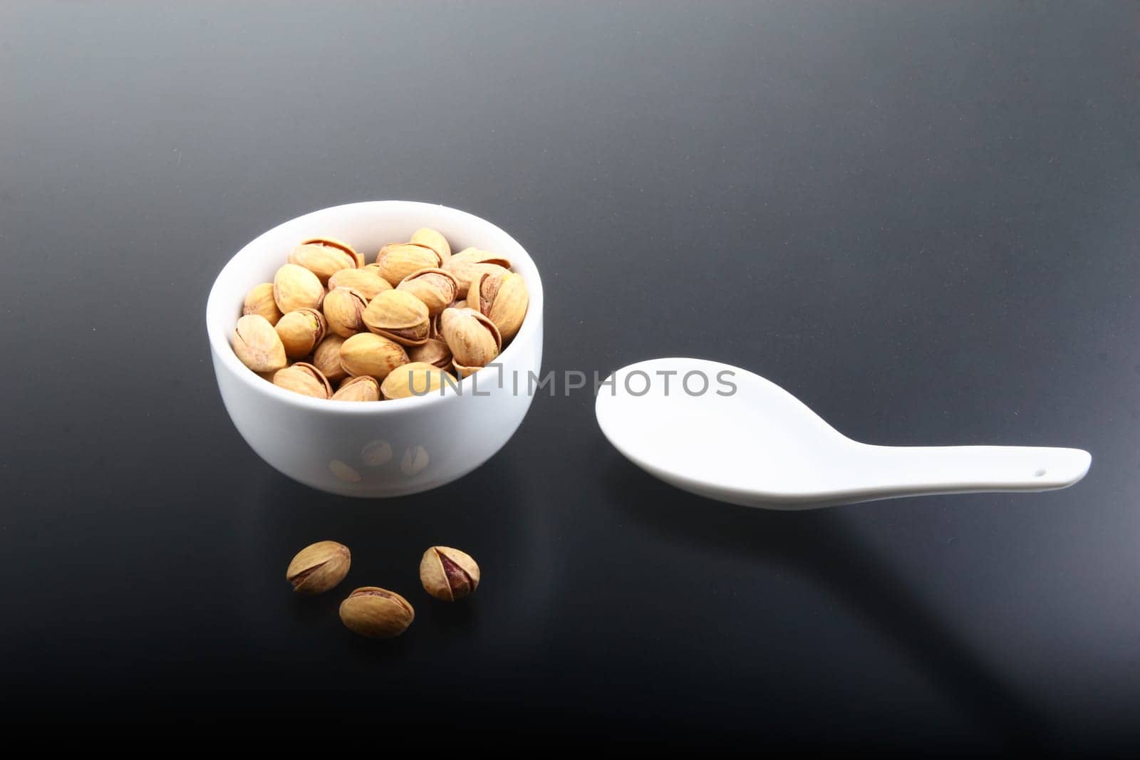 Salted pistachios in shell and loose