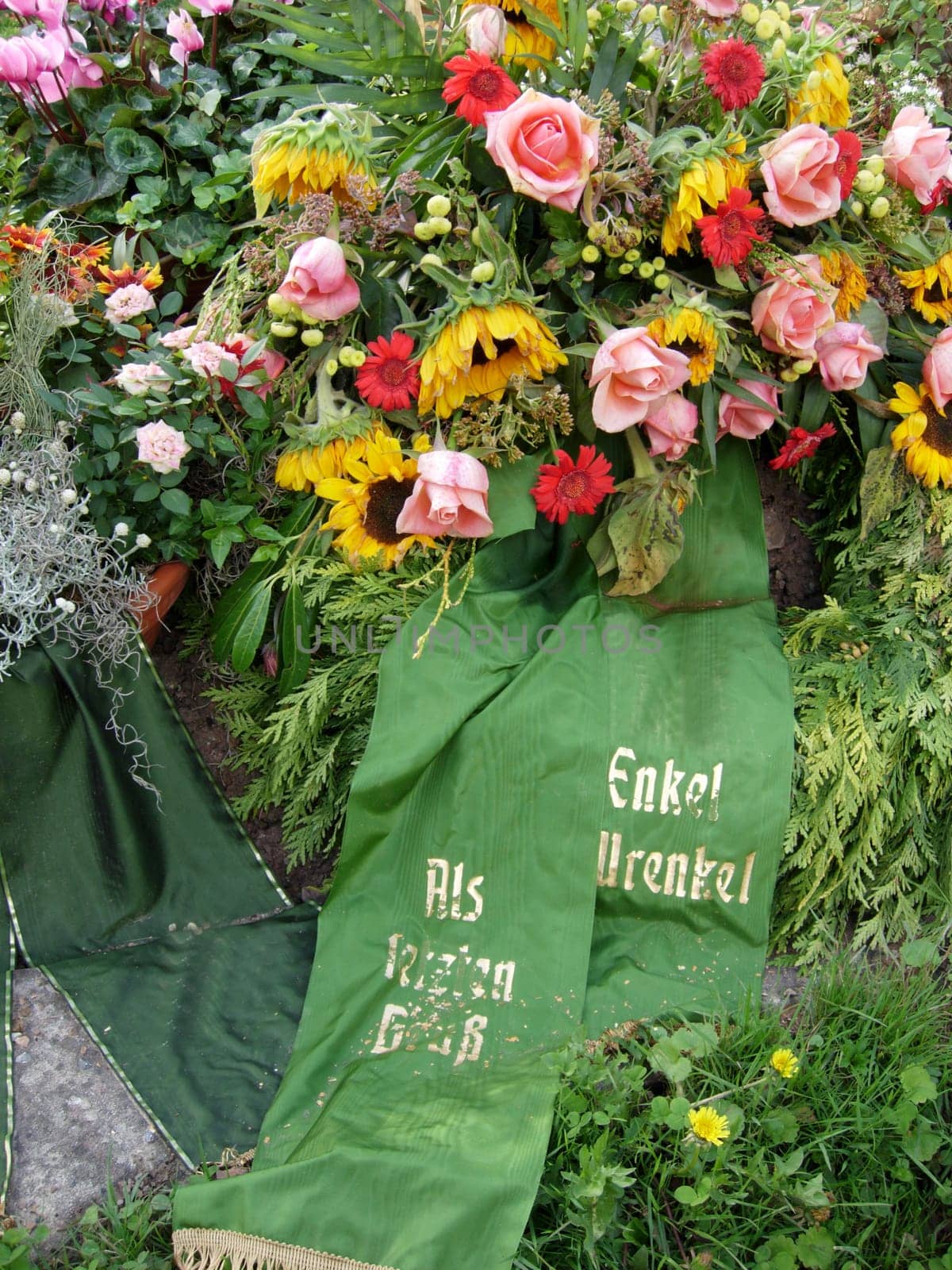Flowers and wreaths on a grave