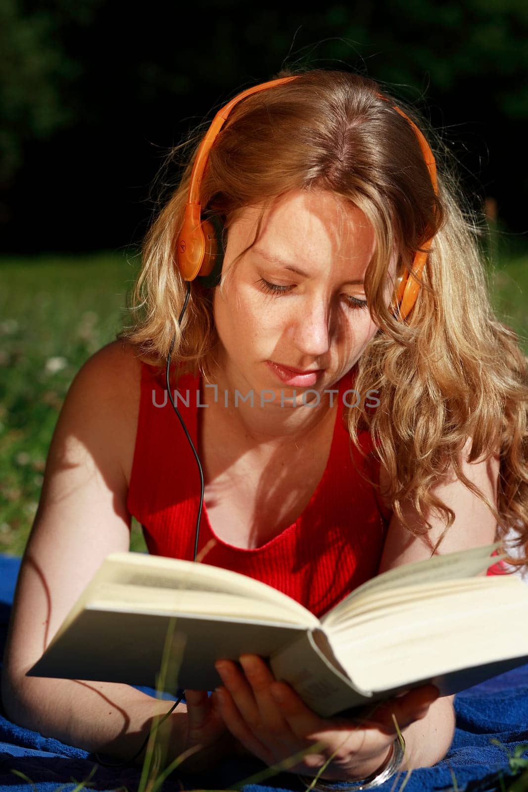 Student with book and headphones VIII