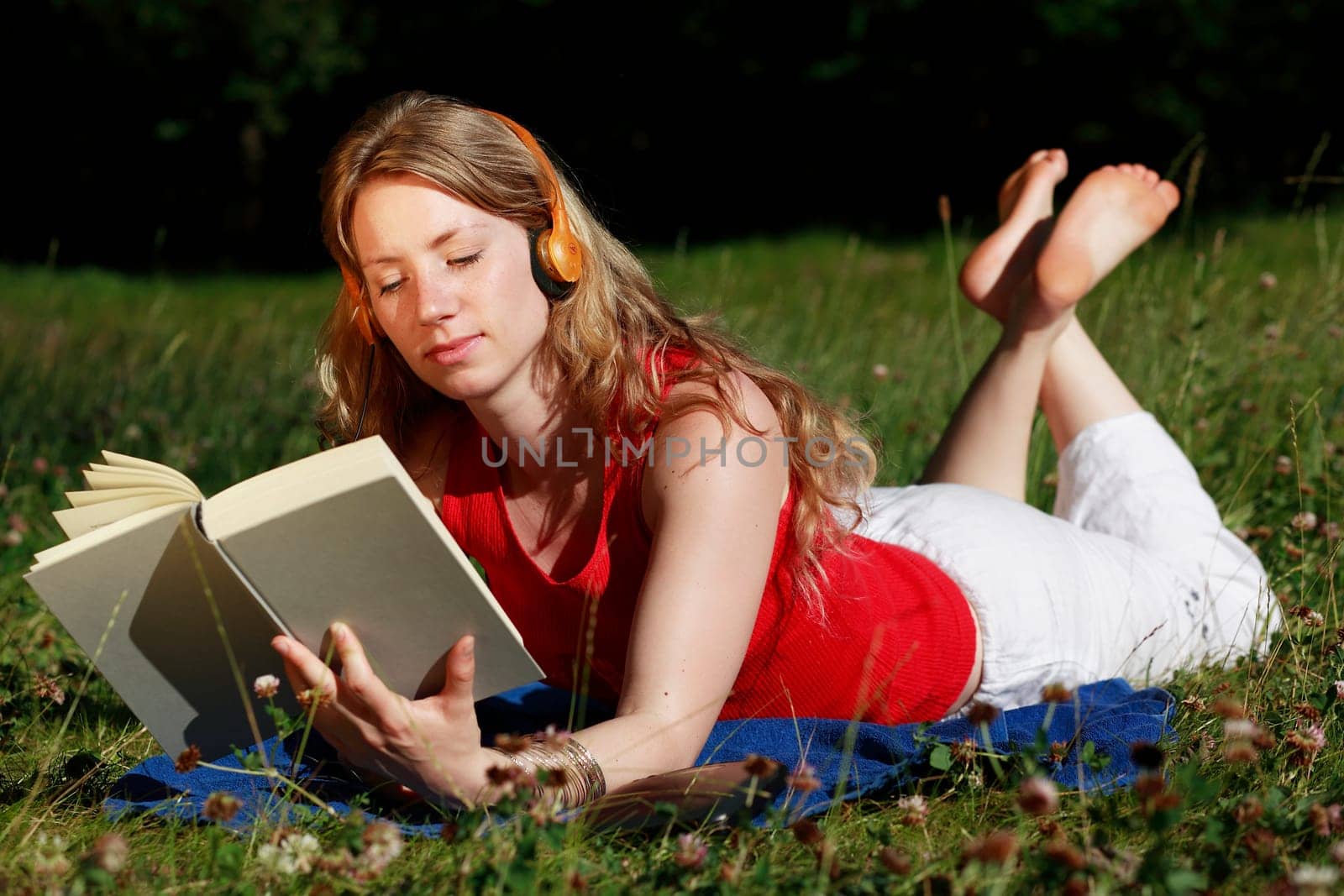 Student with book and headphones XI