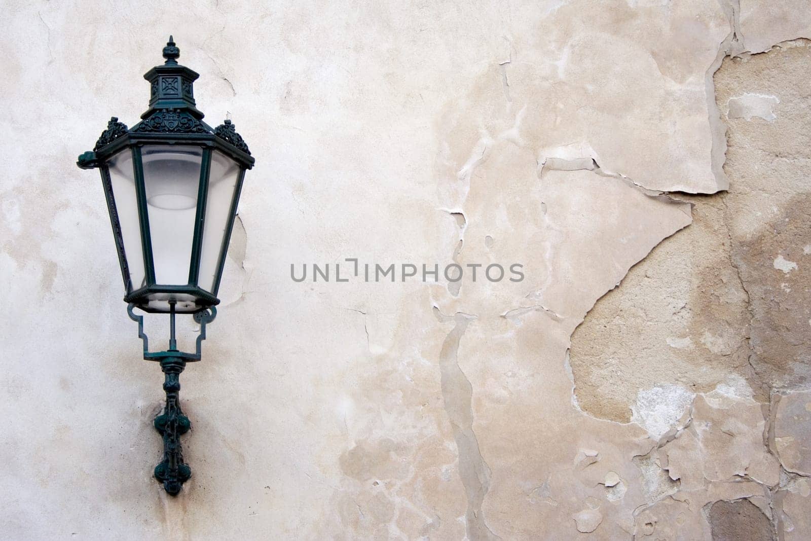 Lantern on weathered wall