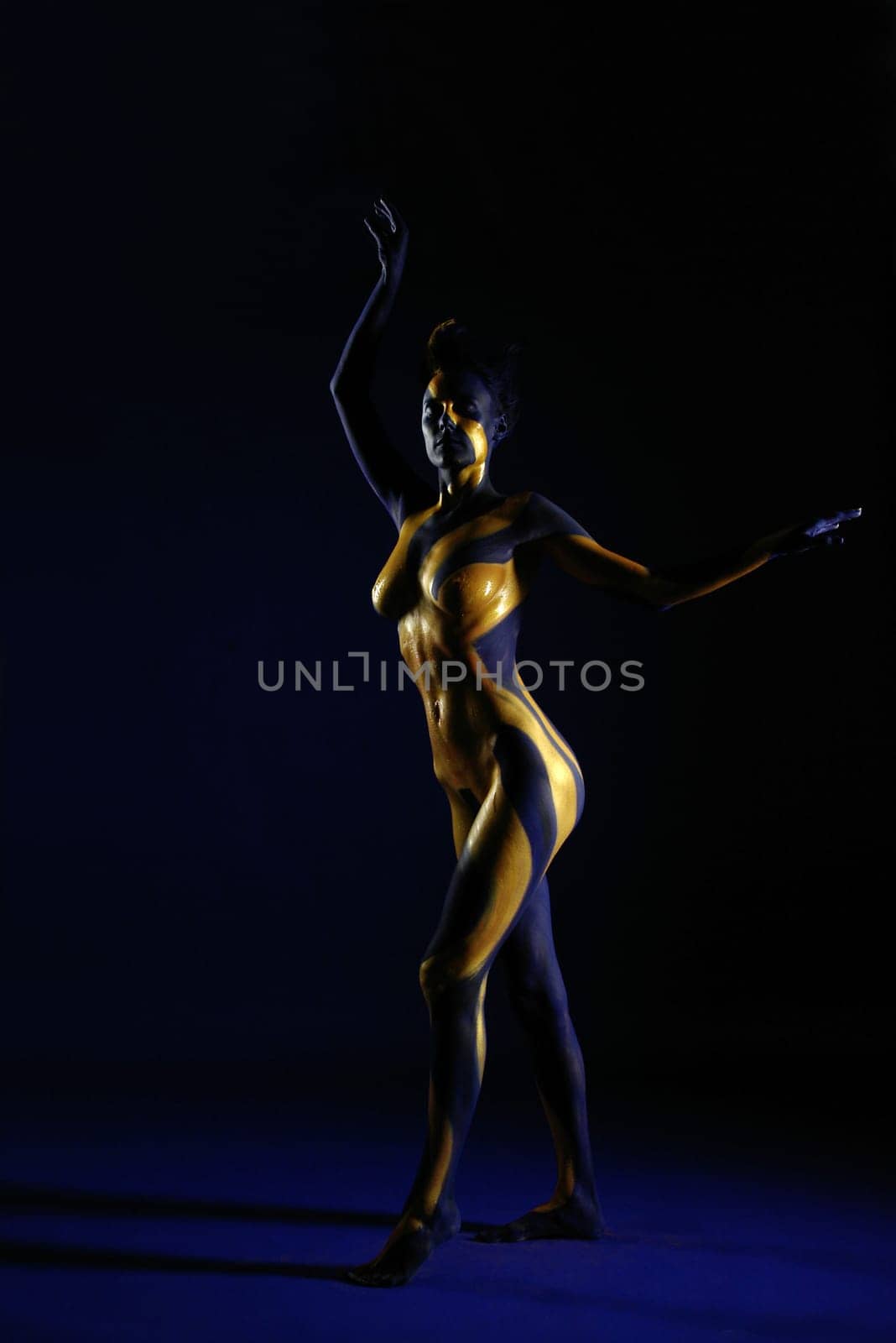 Woman,Bodypainting,Painted,Blue,Yellow,Gold,Sun,Ray,Rays,Body,Nude,Nude,Breast,Body Painting,Painted,Color,Torso,Sculpture,Statue,Art,Calendar,Static,Abstract,Figure