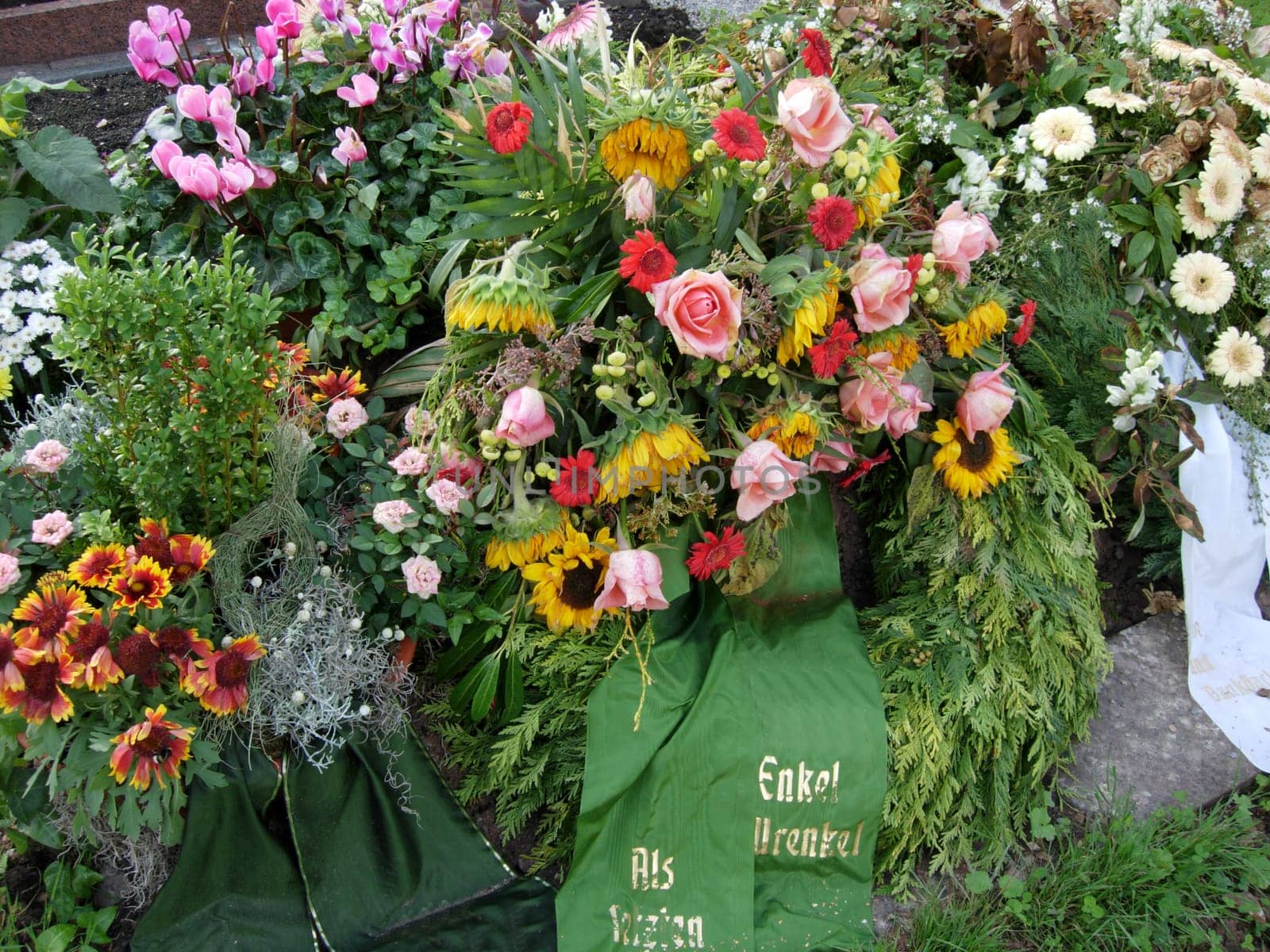 Flowers and wreaths on a grave