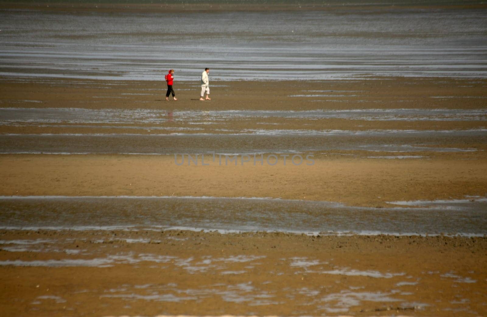 Two people in the Wat of the North Sea off Cuxhaven