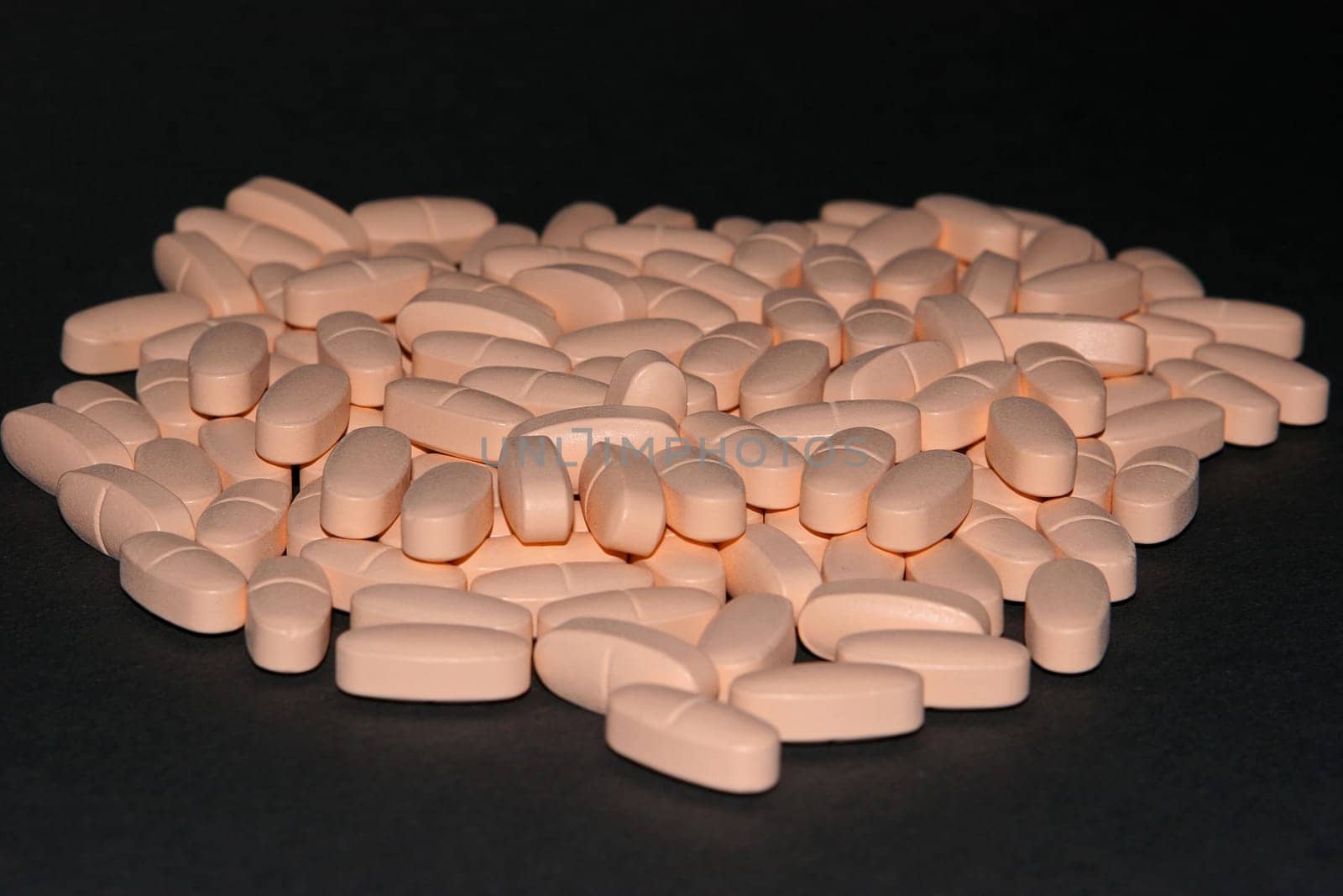 112 tablets on a black background